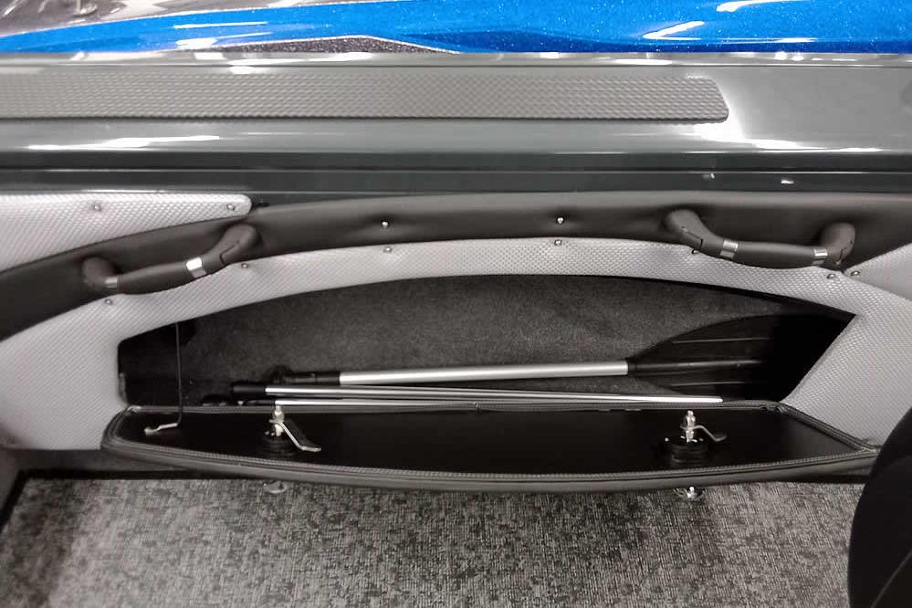 Interior storage compartment of 2026 Ranger VX1888 WT boat, featuring paddle storage.