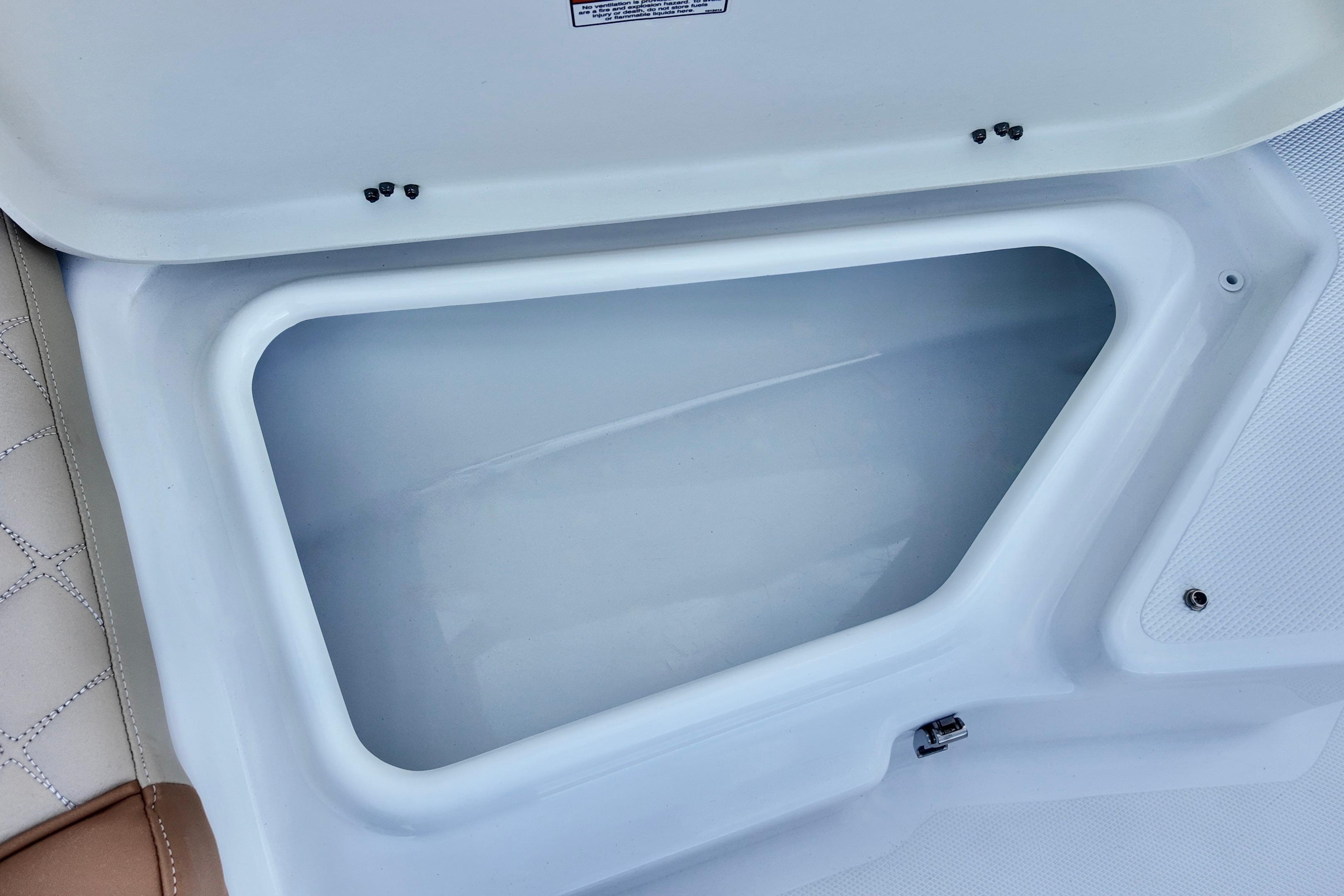Open storage compartment on 2025 NauticStar 211 Hybrid boat.