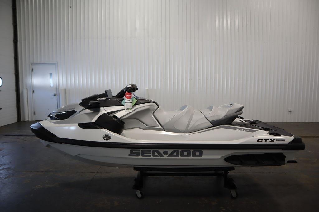 2026 Sea-Doo GTX Limited 325 jet ski in a showroom, side view.