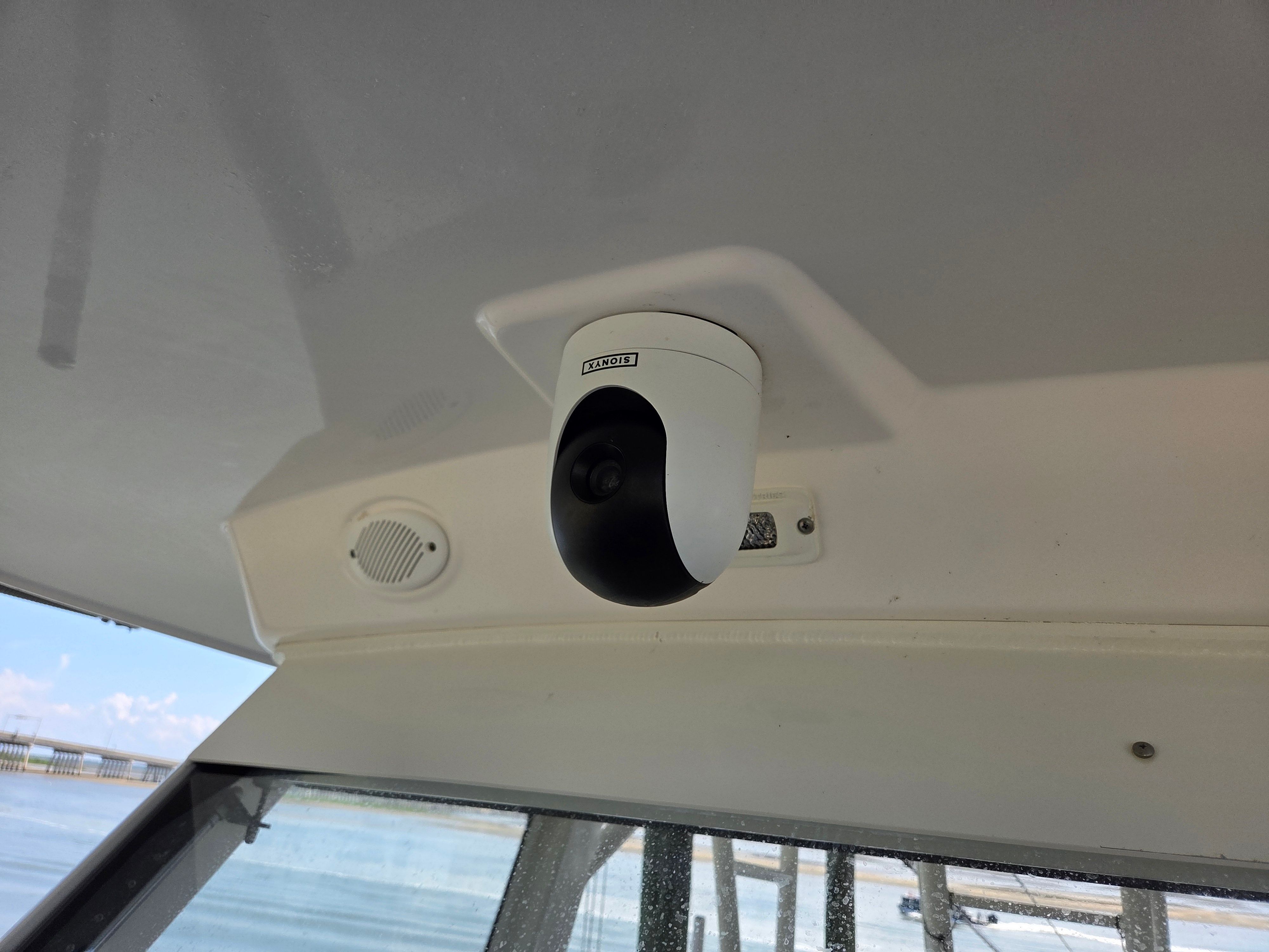A camera is mounted on the ceiling of a boat.