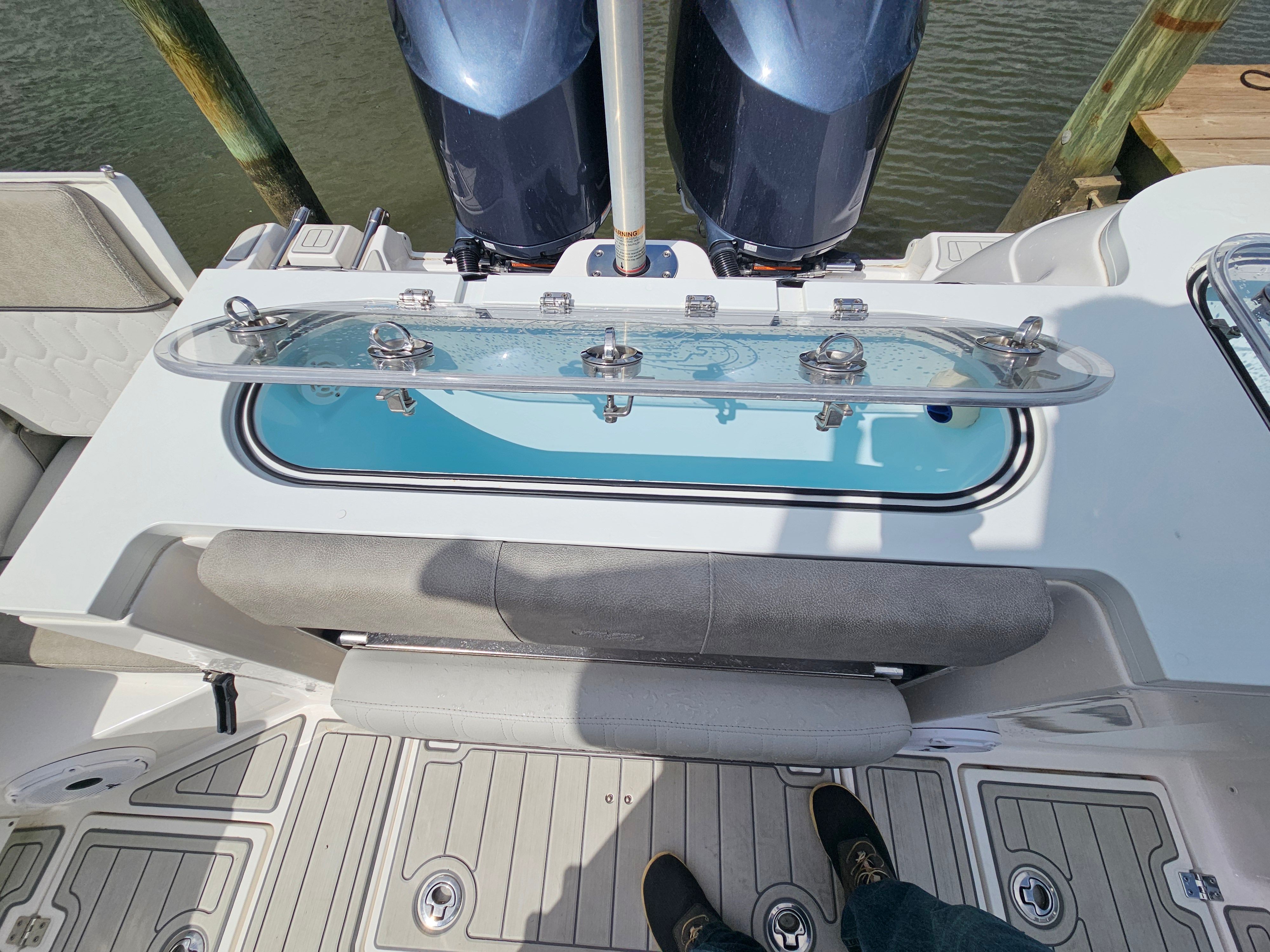2021 Sea Fox 288 Commander with engines and seating area.