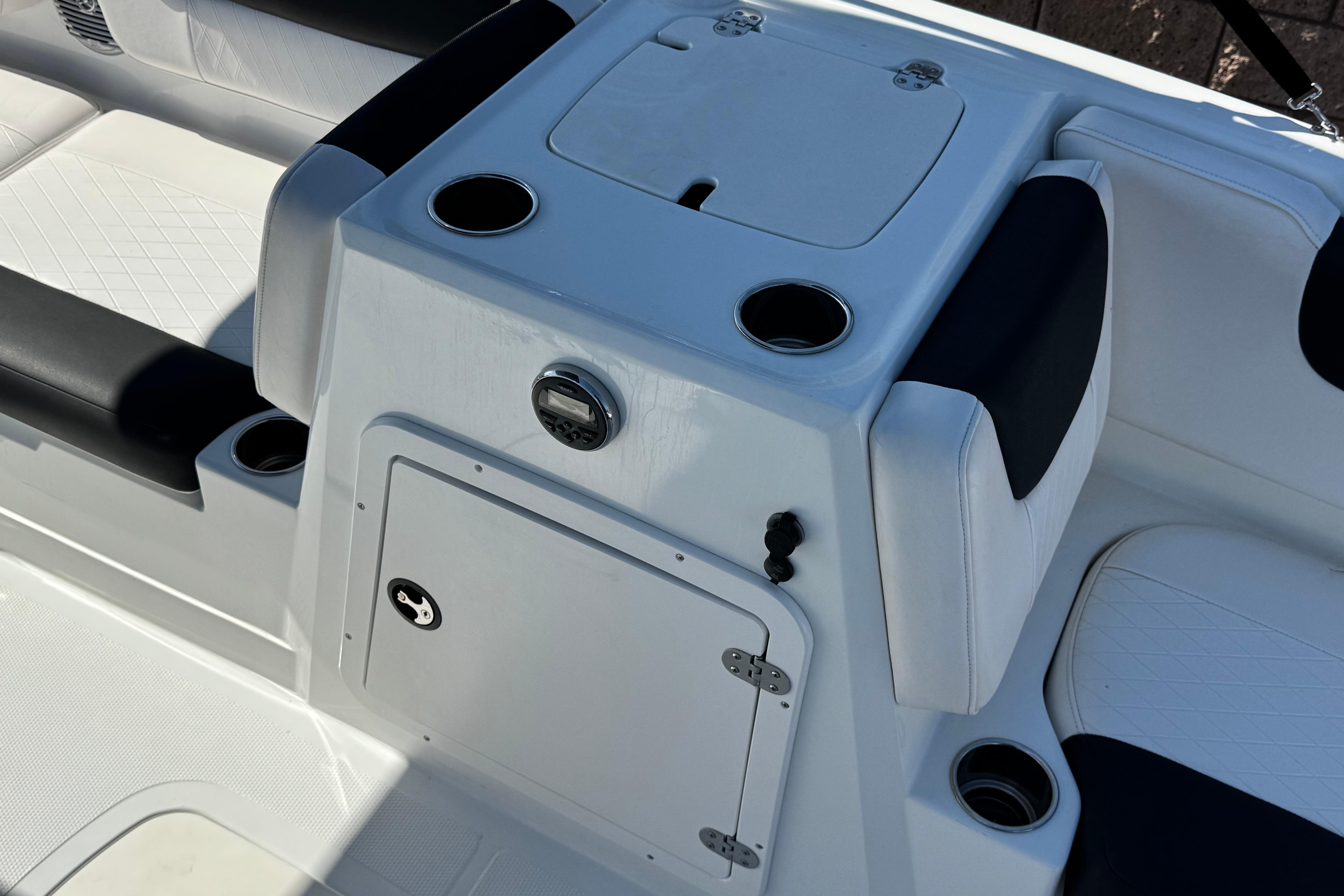 2019 Tahoe 2150 boat interior with white seating and cup holders.