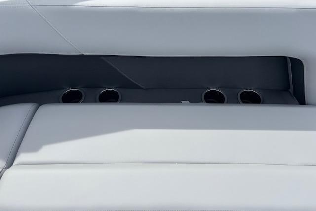2026 Sun Tracker Party Barge 16 DLX seating with integrated cup holders.