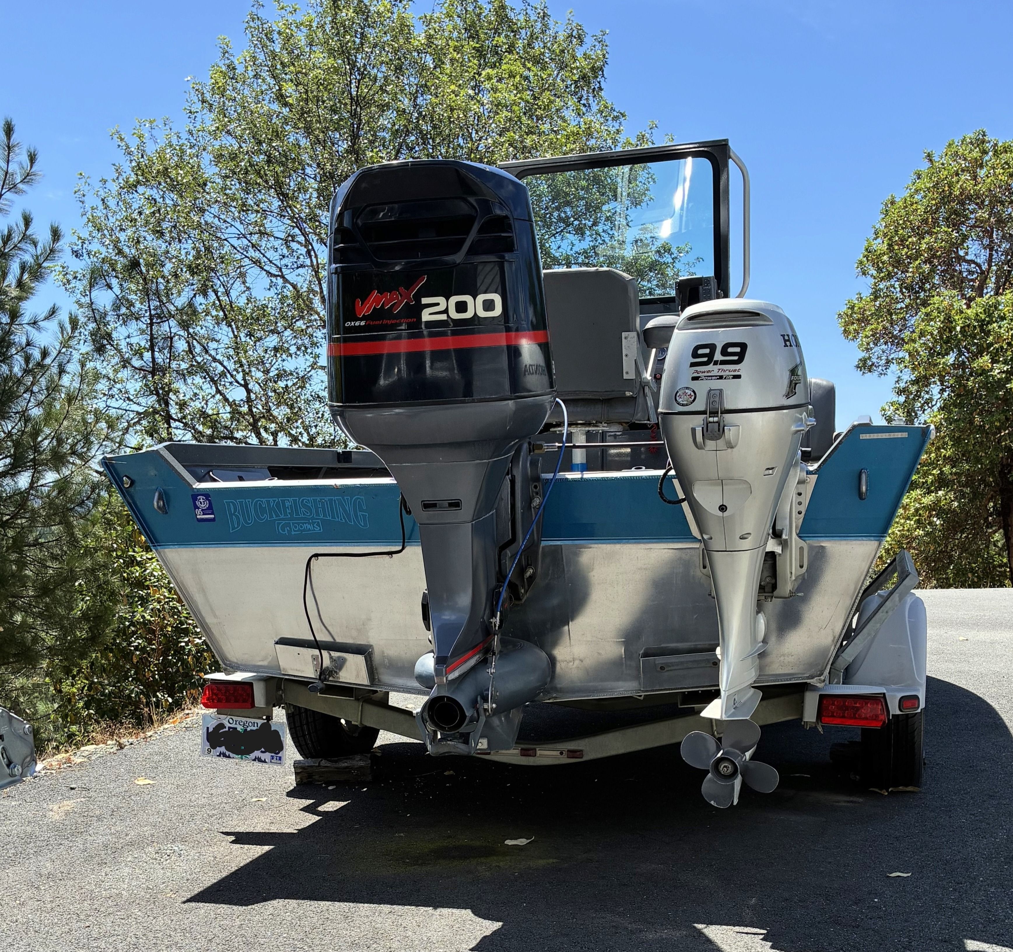 2003 North River SCOUT with two outboard motors on a trailer.
