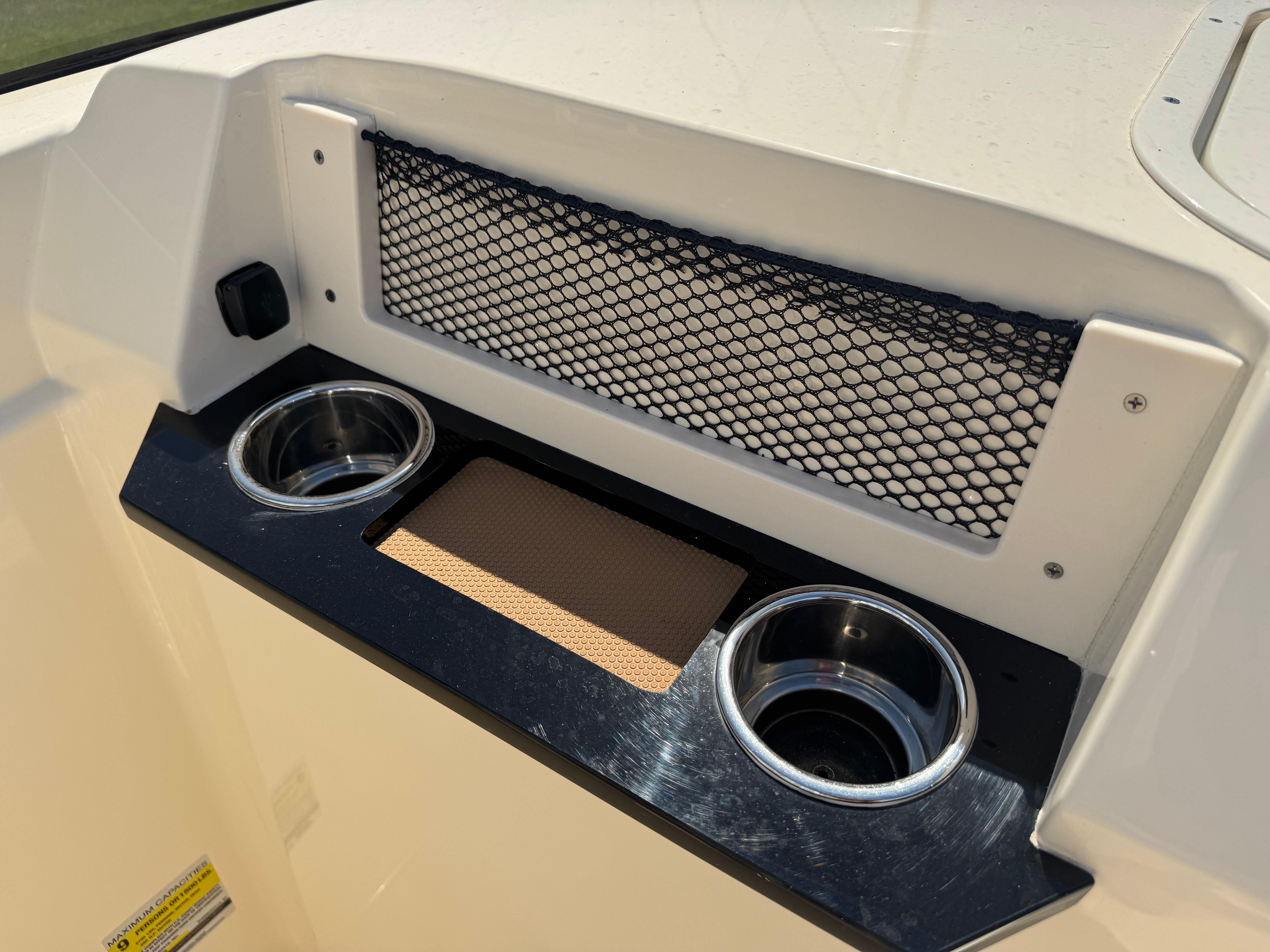2025 Scout 215 Dorado boat console with cup holders and storage net.