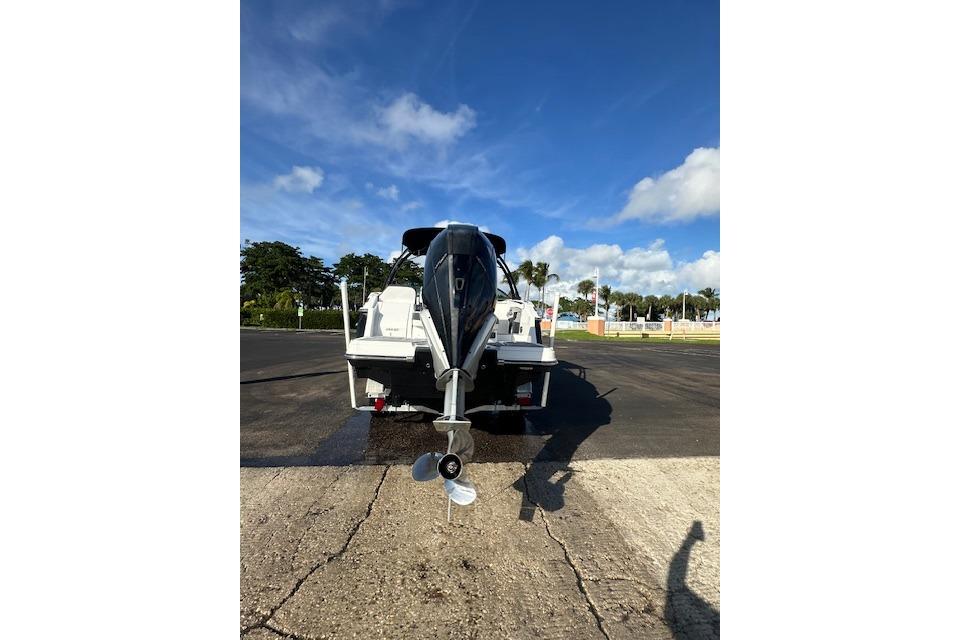 2022 Monterey 255SS Super Sport boat on trailer, rear view under clear blue sky.