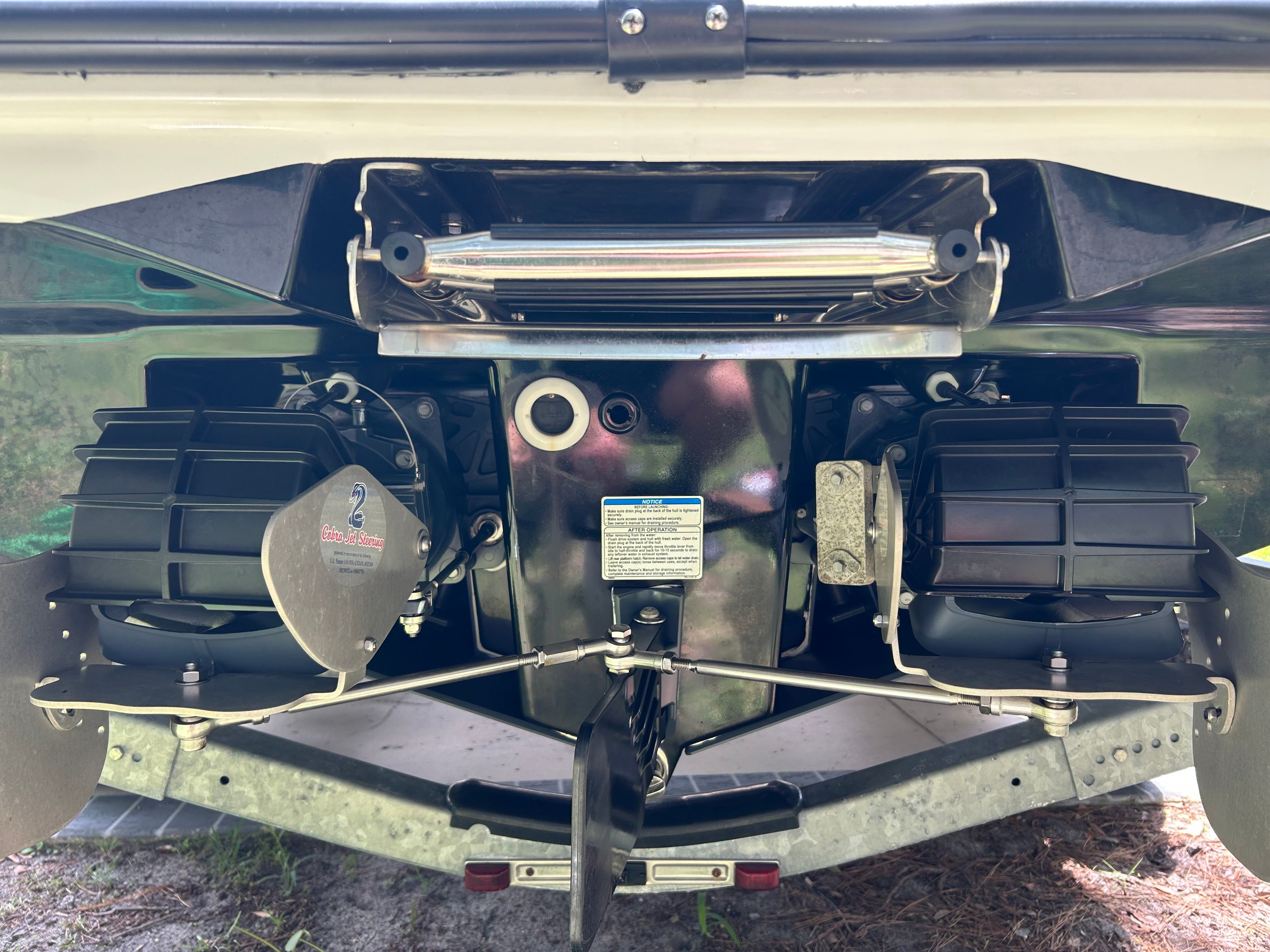 Rear view of a Yamaha AR220 boat with dual jet drives.