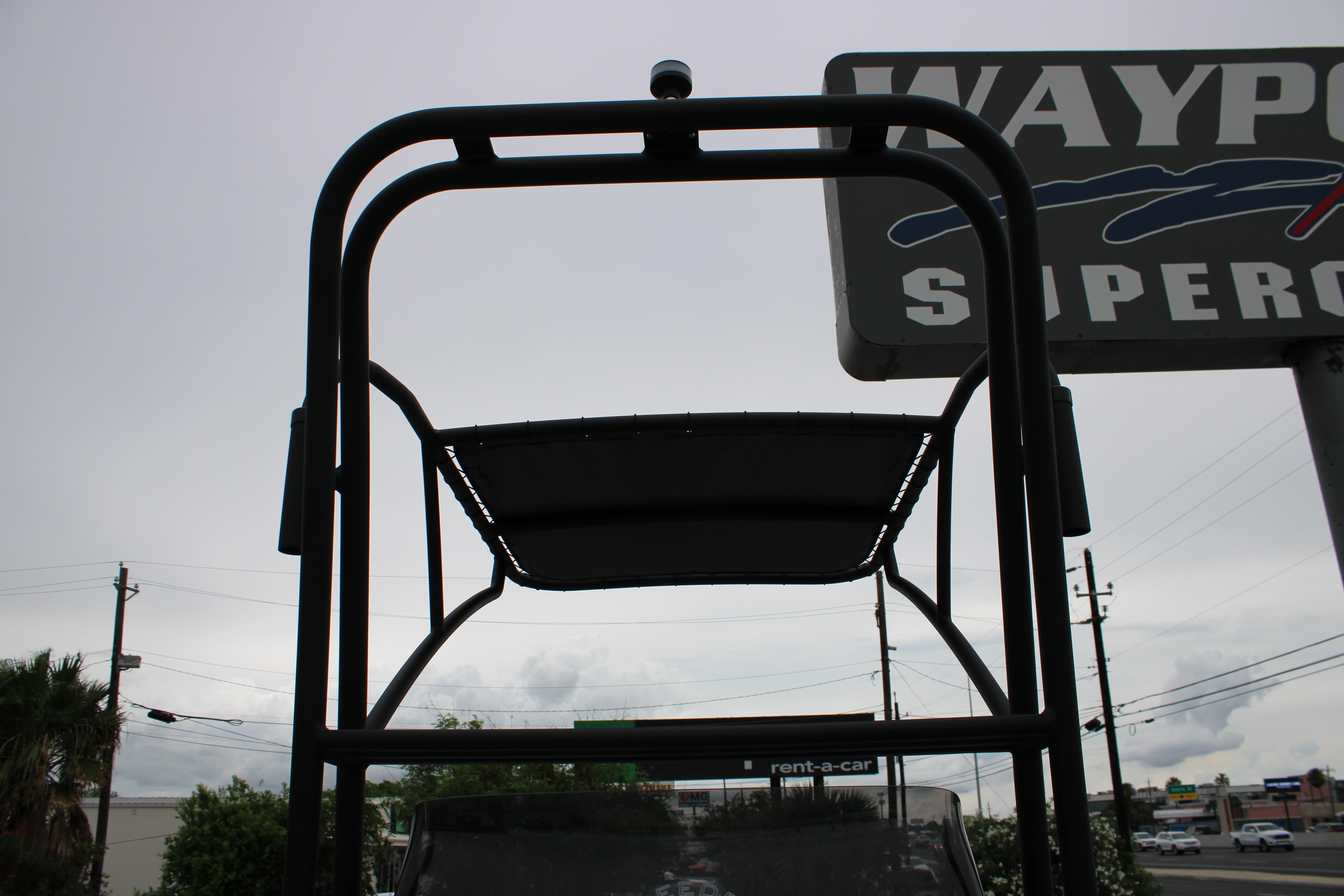 2026 Freedom Boats 24 Defender, viewed from below, with a cloudy sky backdrop.