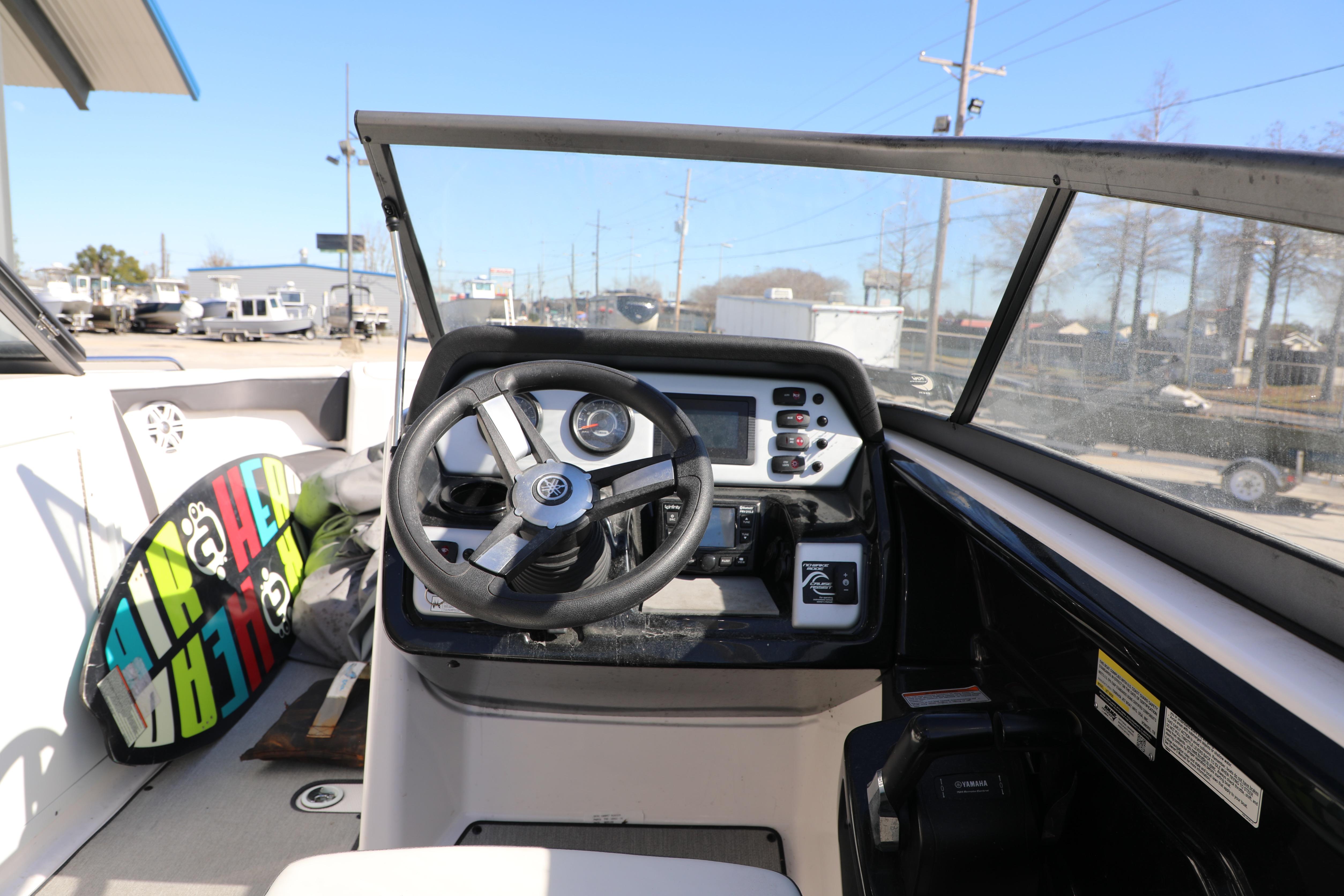 2022 Yamaha Boats AR210 dashboard with steering wheel and control panel.