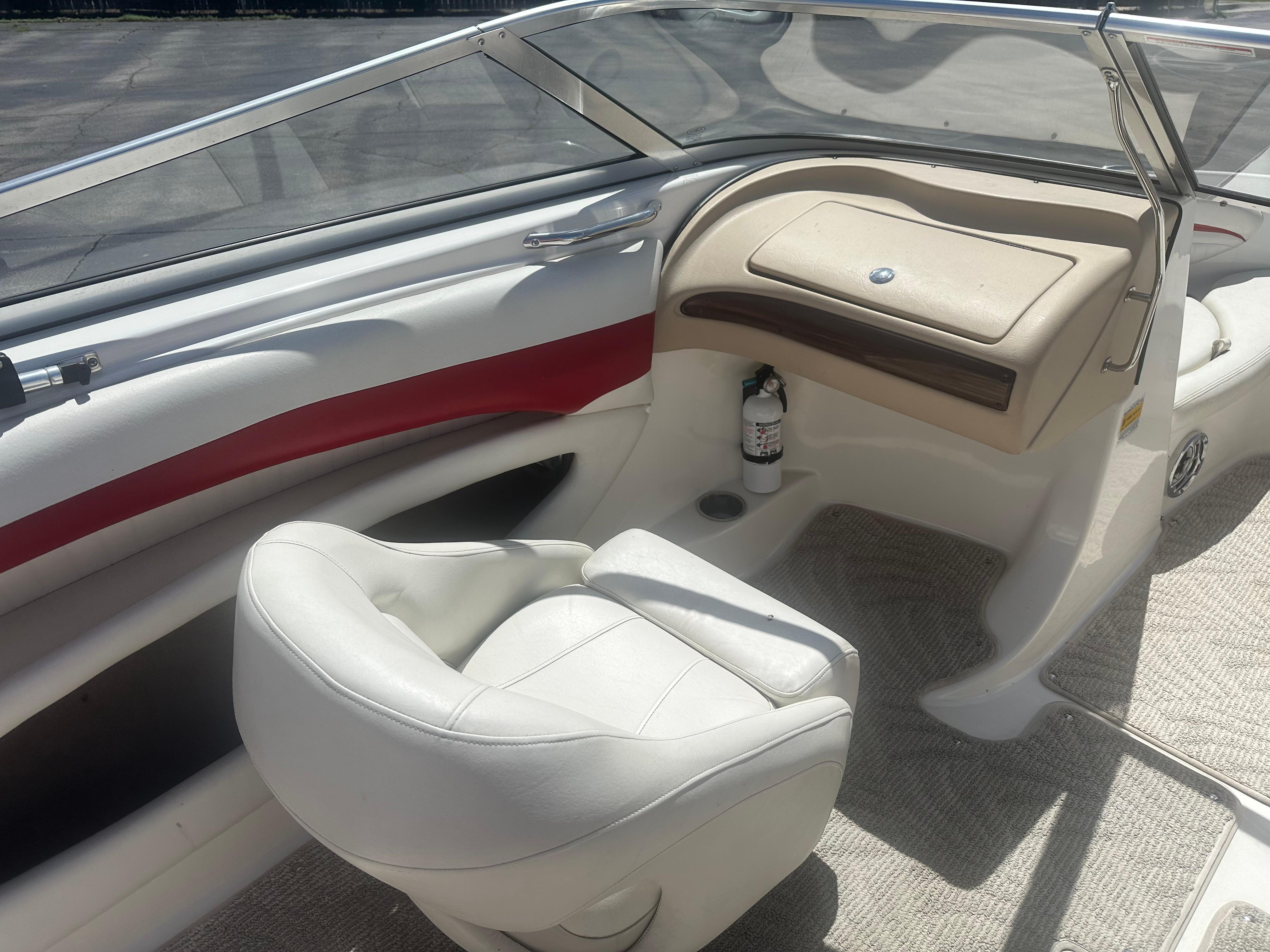 2008 Glastron 205 GX boat interior with white seating and dashboard.