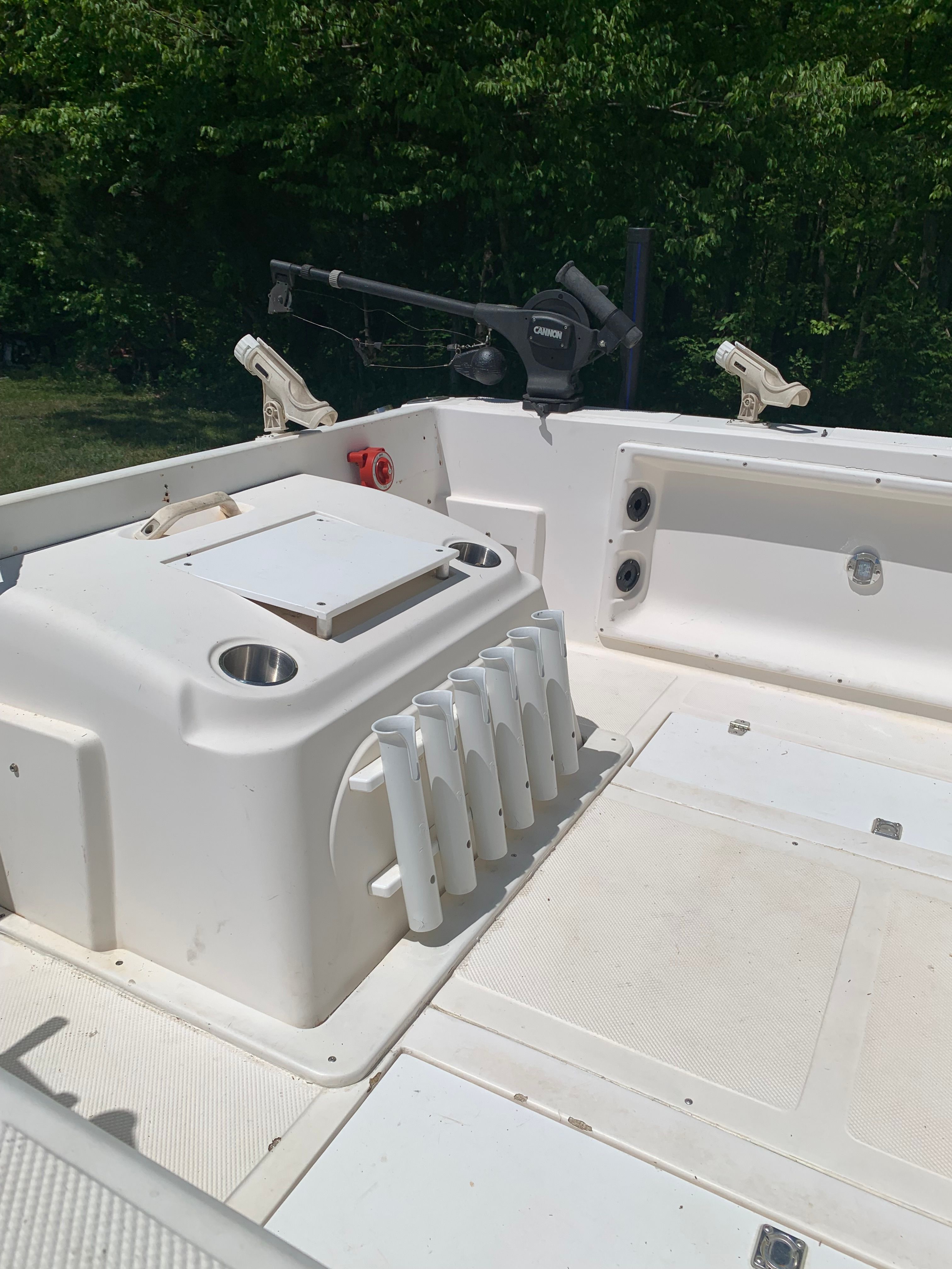 Interior of a 1998 Eurosport 221WA boat with fishing rod holders.