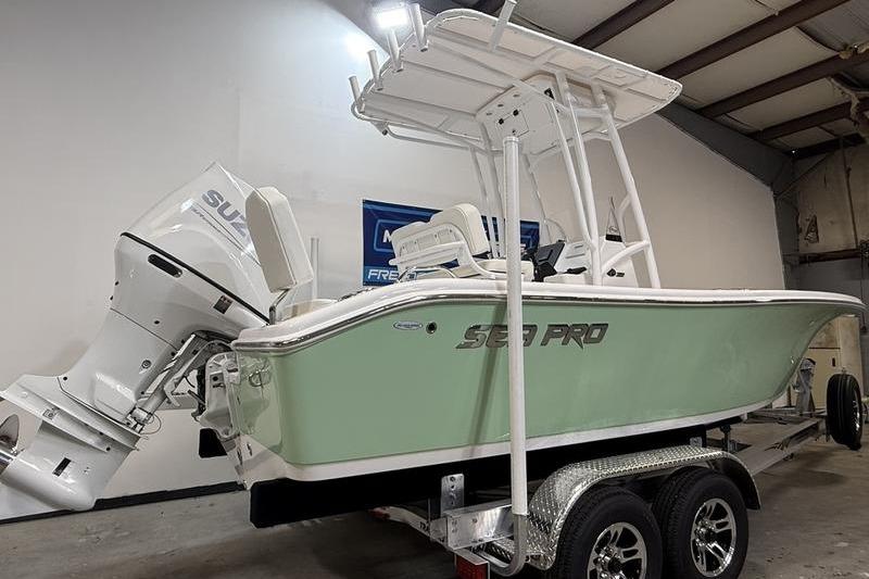 2026 Sea Pro 202 Center Console boat on trailer in indoor storage.