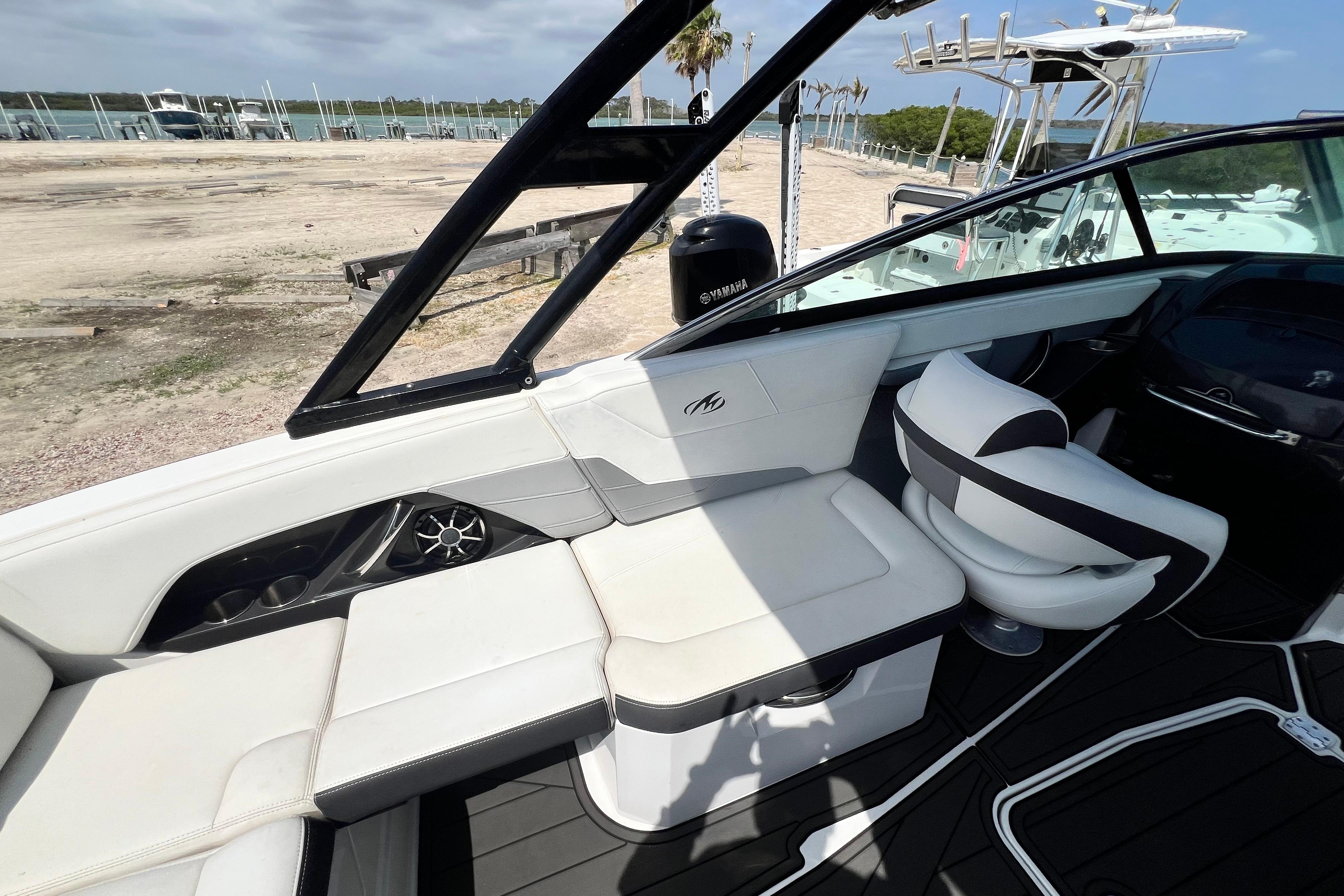 Interior of a 2015 Monterey 268SS Super Sport boat with white seating and black accents.