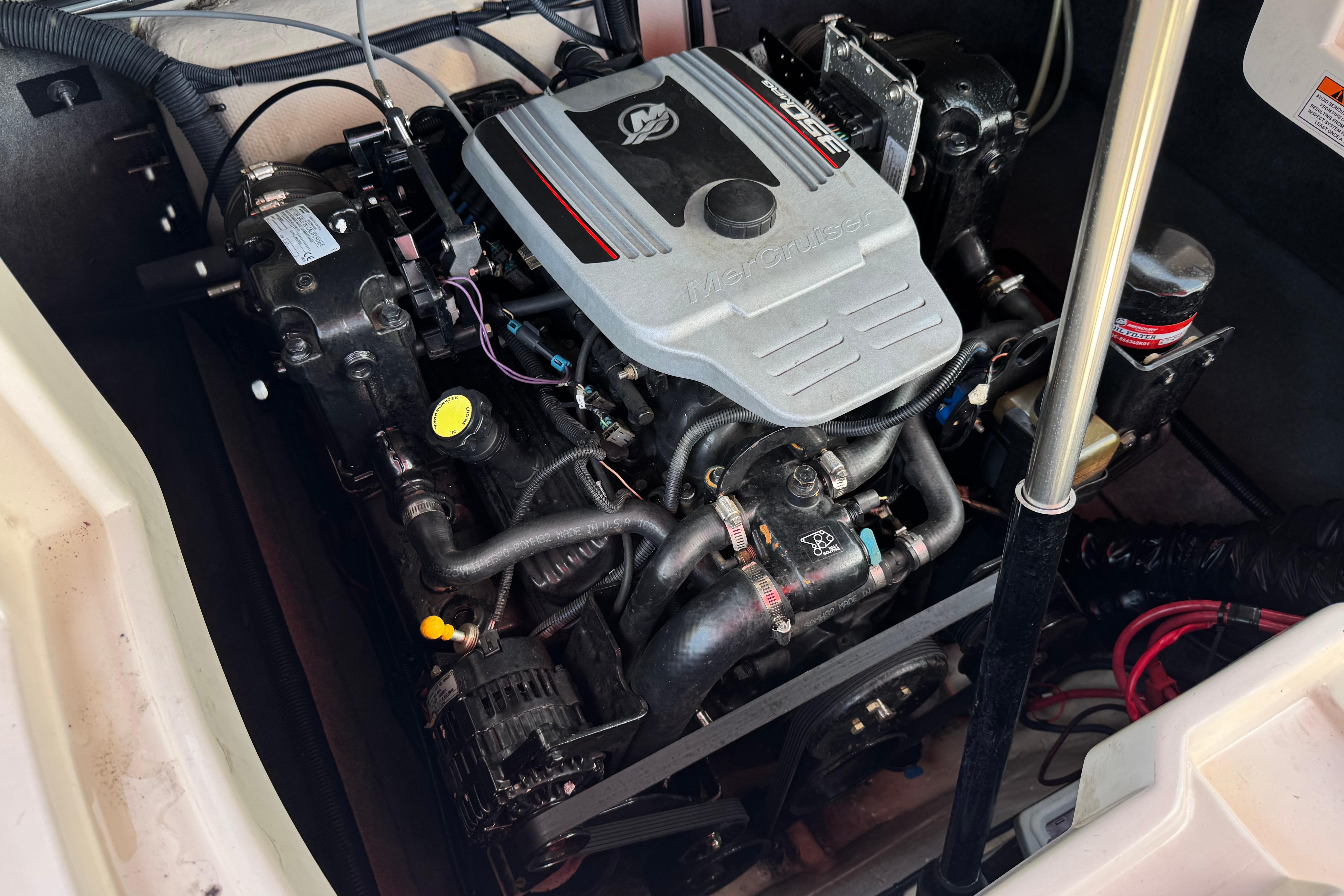 Engine compartment of a 2010 Bryant 255 boat, featuring a MerCruiser engine.