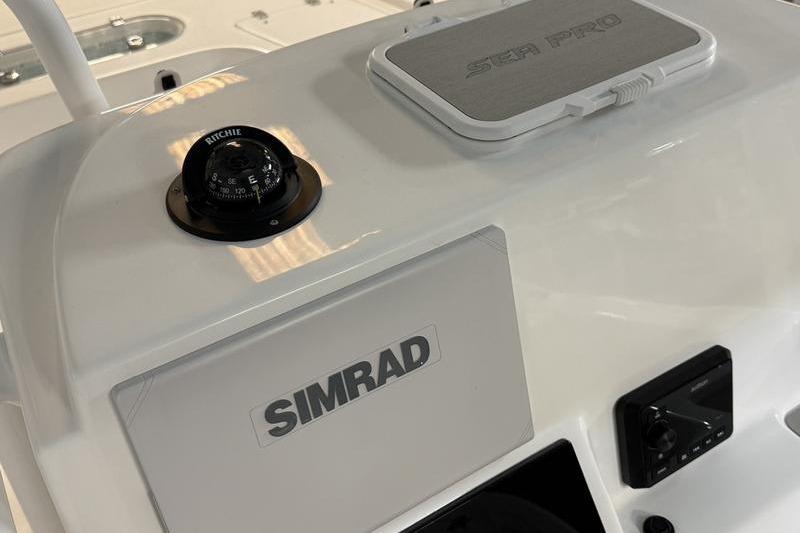 2026 Sea Pro 250 Bay boat dashboard with Simrad and Ritchie compass.