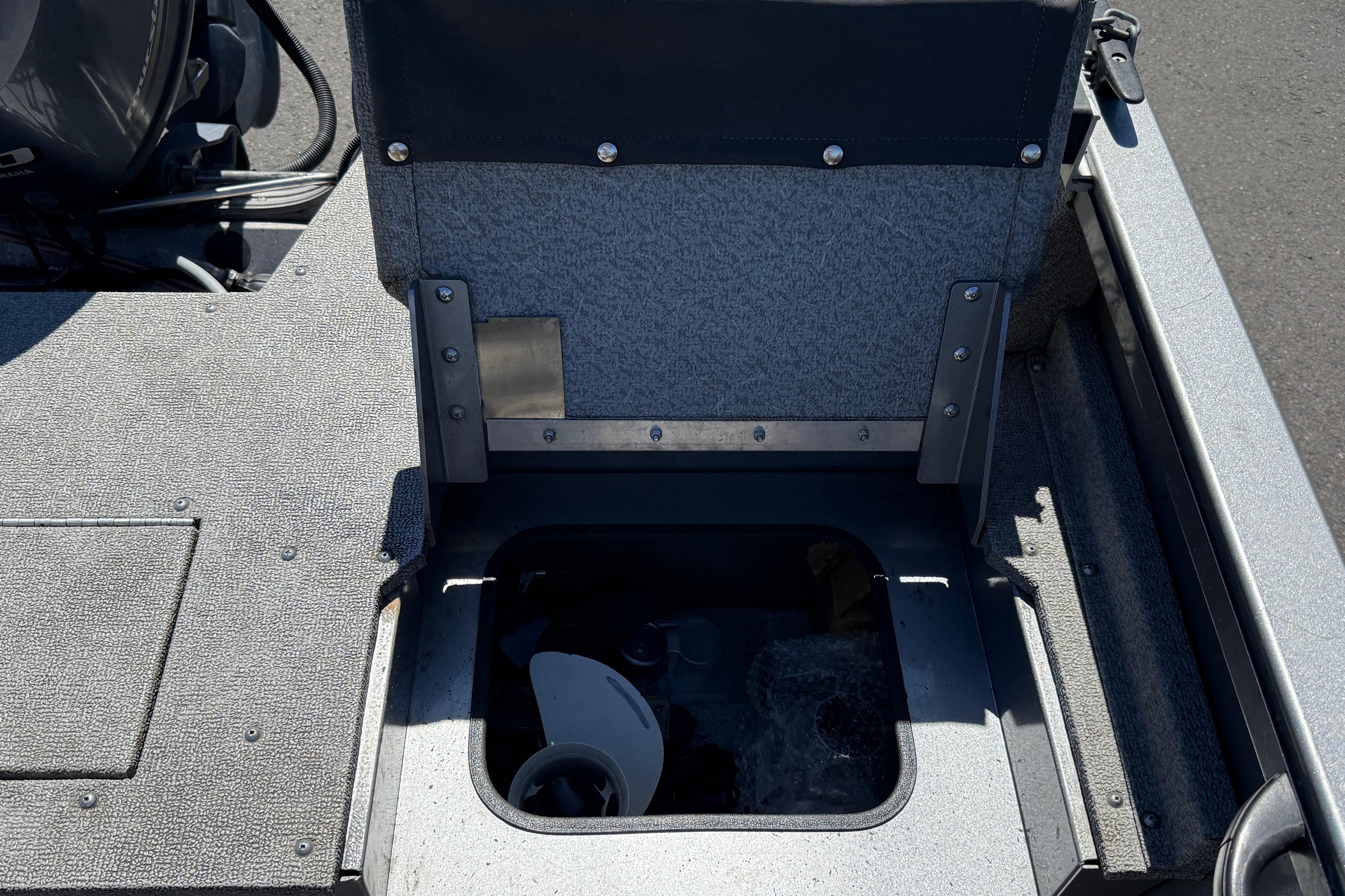 2016 Crestliner 1700 Vision boat interior with open storage compartment.