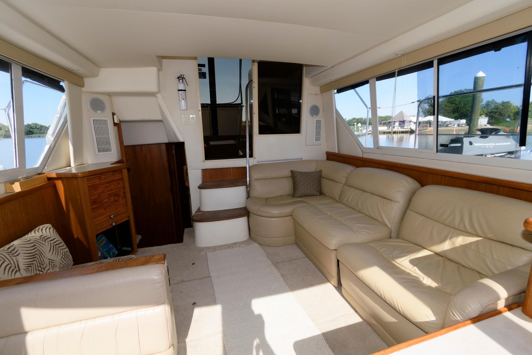 Interior of 1997 Carver 400 Cockpit Motor Yacht with leather sofa.