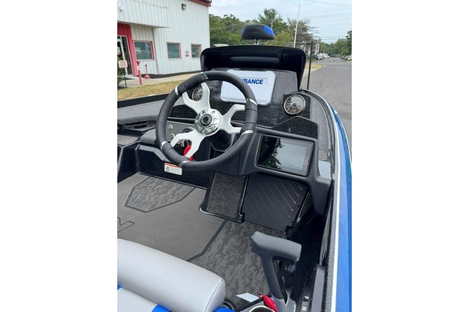 2026 Nitro Z21 XL boat cockpit with steering wheel and dashboard controls.
