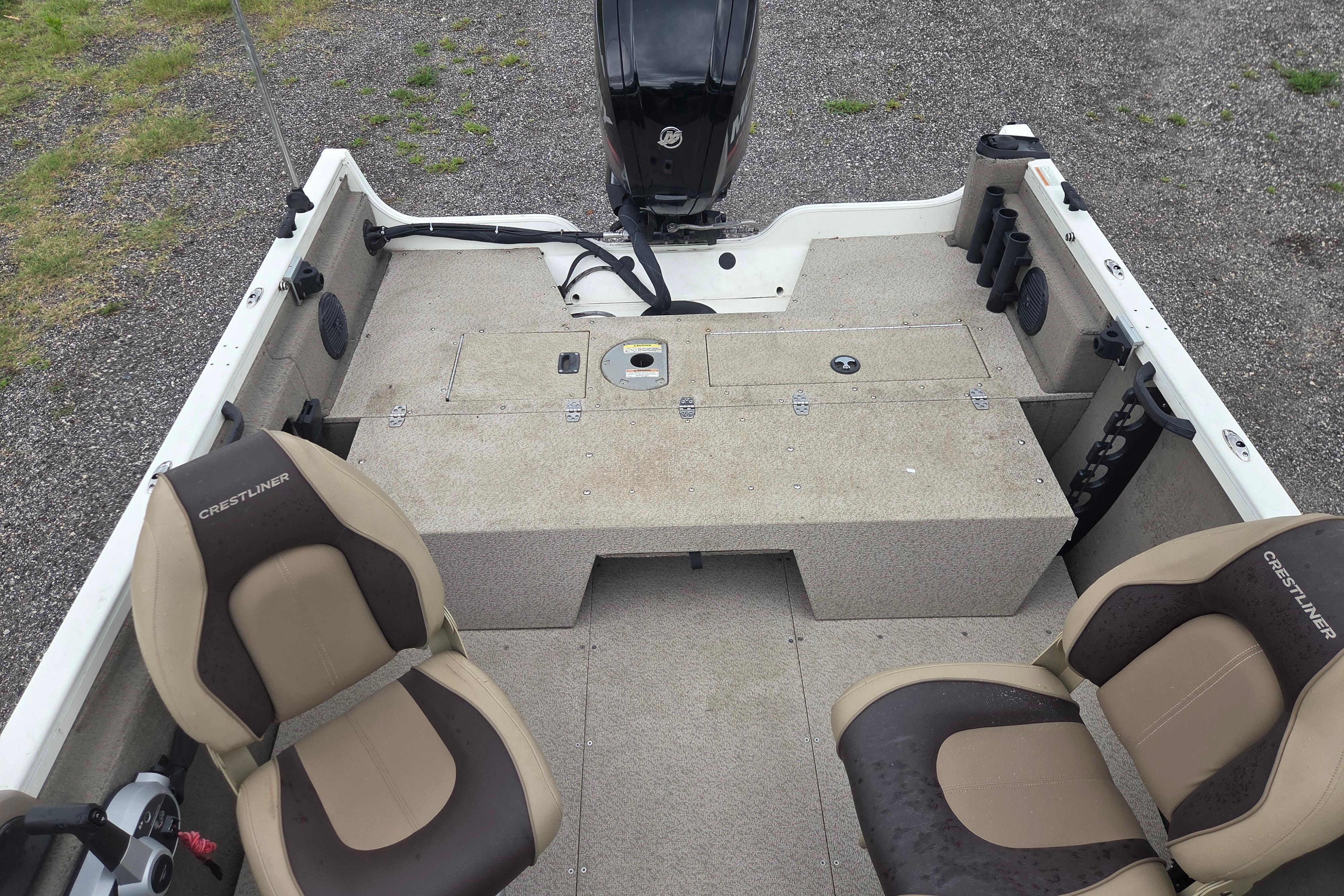 2016 Crestliner 1650 Fish Hawk SC boat interior with seating and storage compartments.