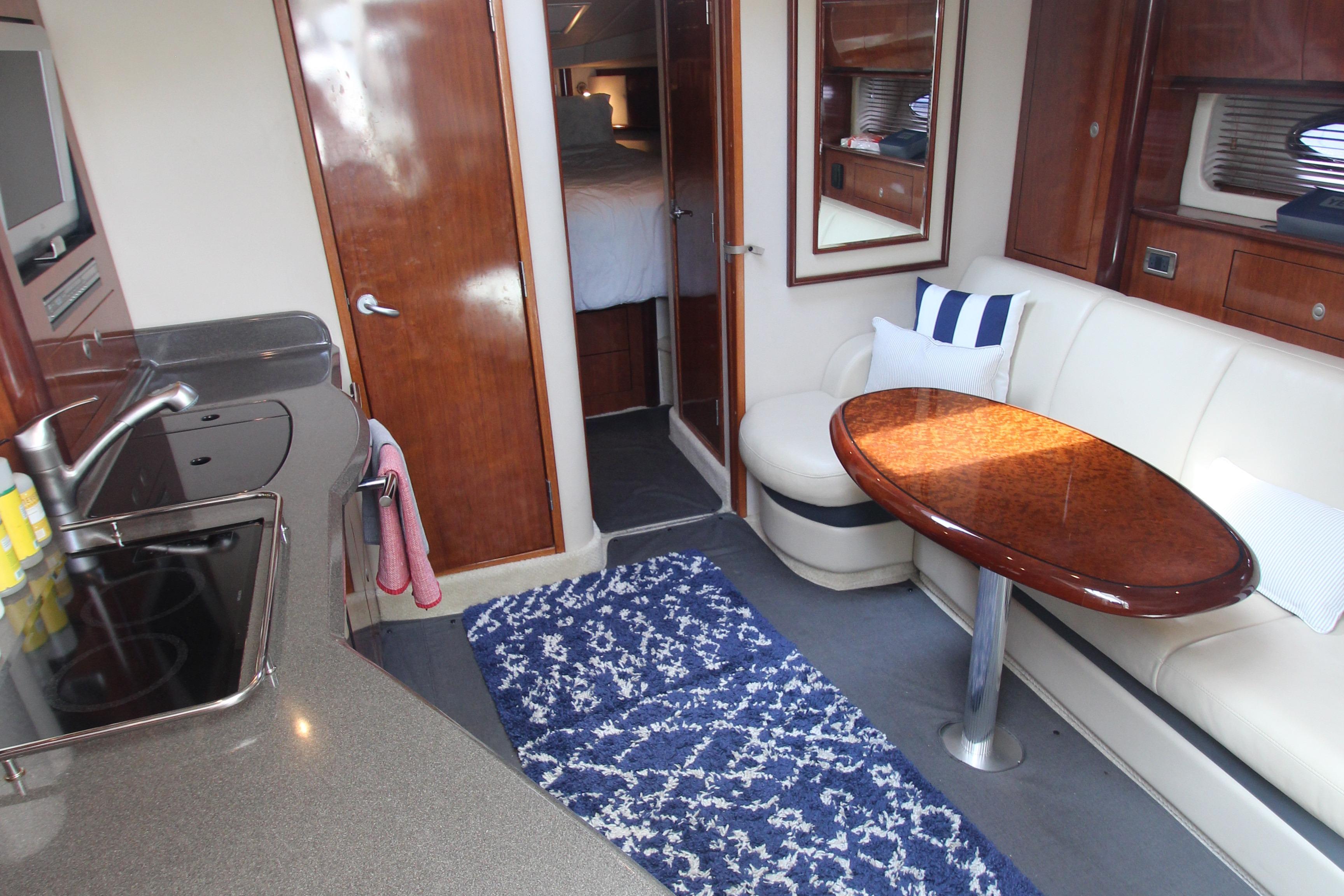 Luxurious 2004 Sea Ray 40 Sundancer interior with elegant seating and modern amenities.