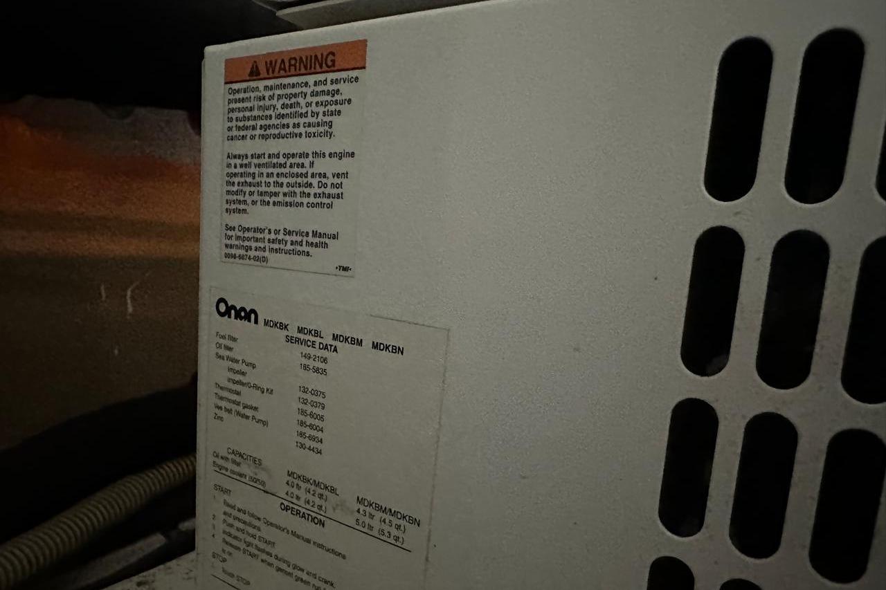 Onan generator warning label and service data on a 2007 Princess 50 yacht.