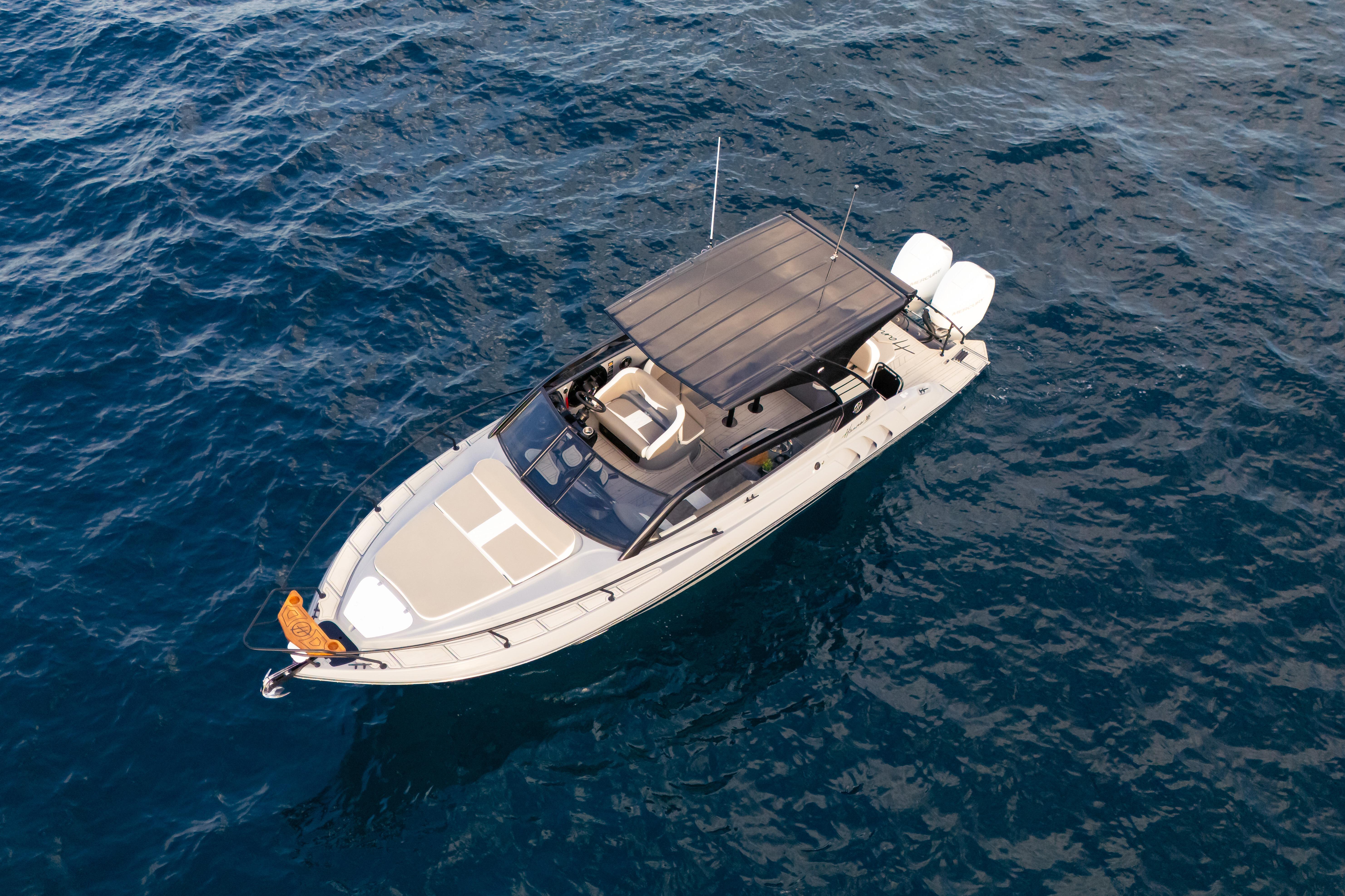 Aerial view of 2026 Hanover 305 boat on open water.