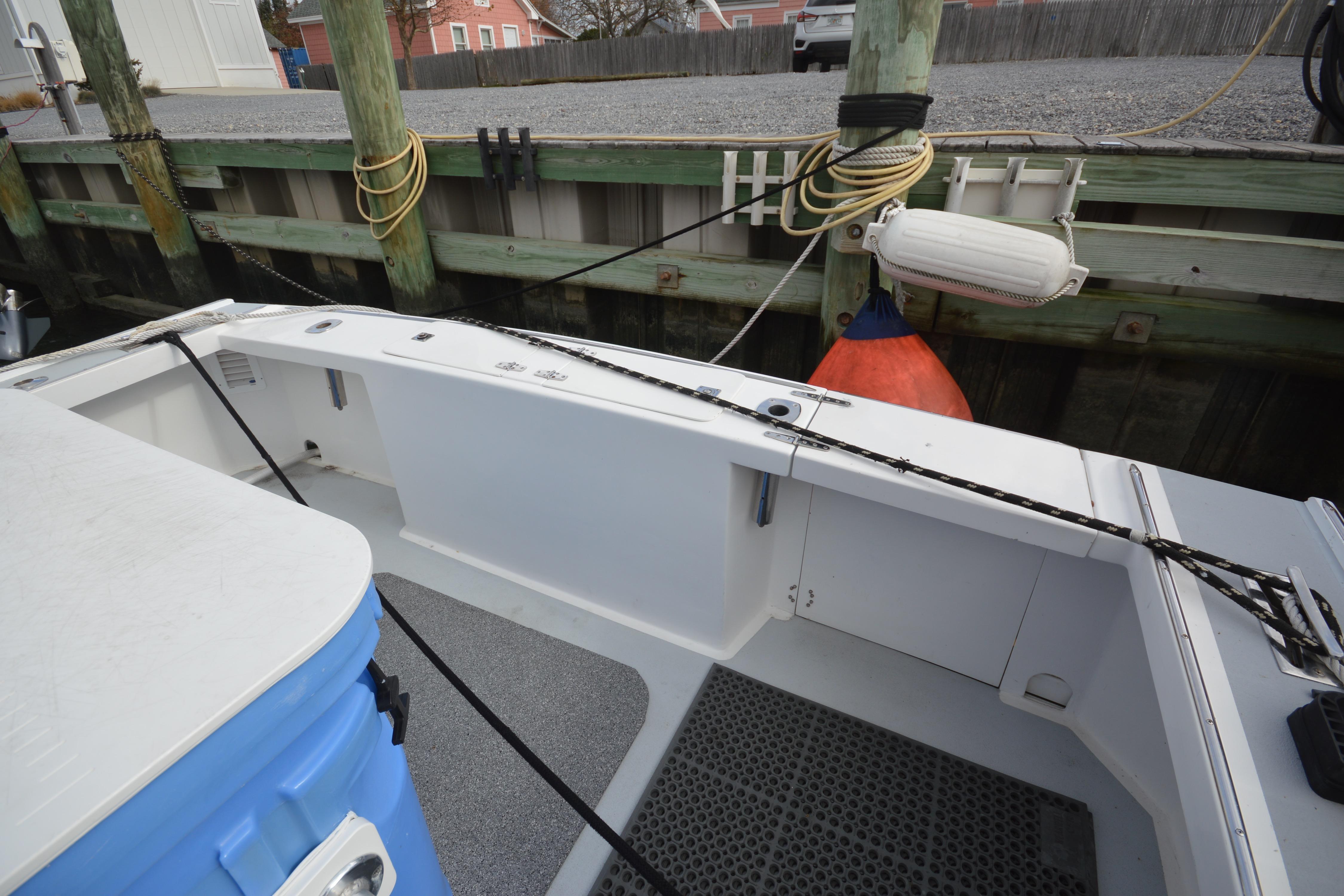 2008 Wayne Beal EXPRESS boat docked, showing deck and mooring setup.