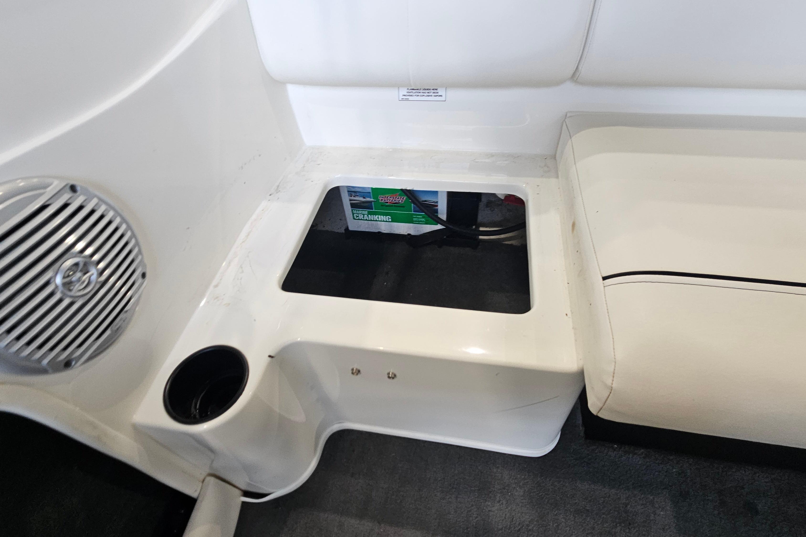 2019 Bayliner 170 Bowrider interior showing battery compartment and speaker.