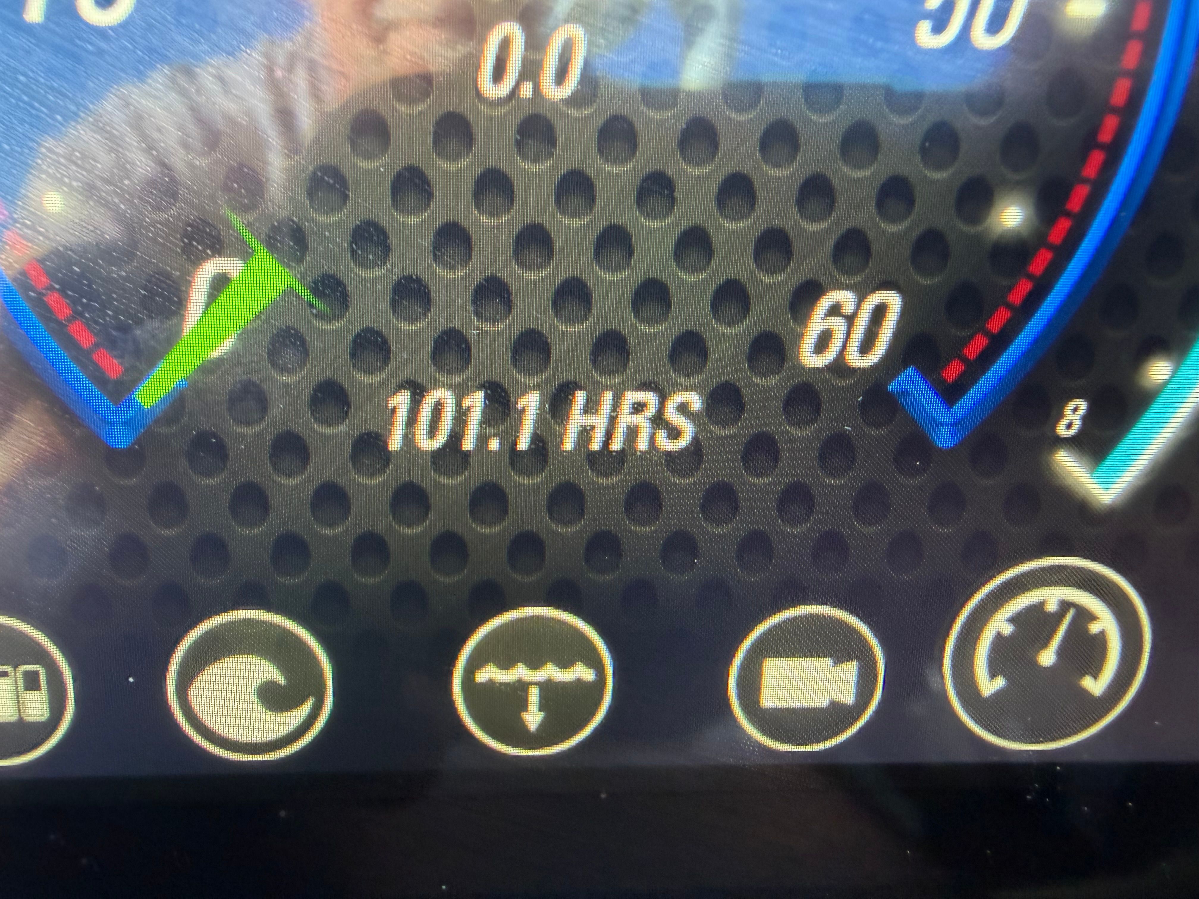 Close-up of a boat instrument display showing 101.1 operating hours.