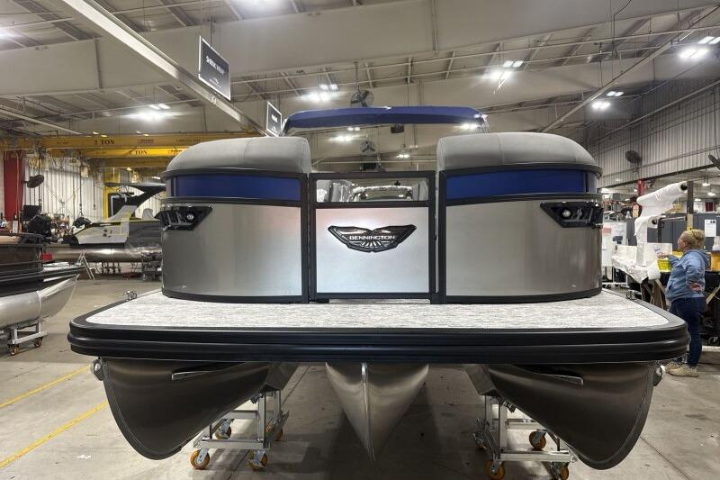2026 Bennington 23 LXS Swingback pontoon boat in a factory setting.
