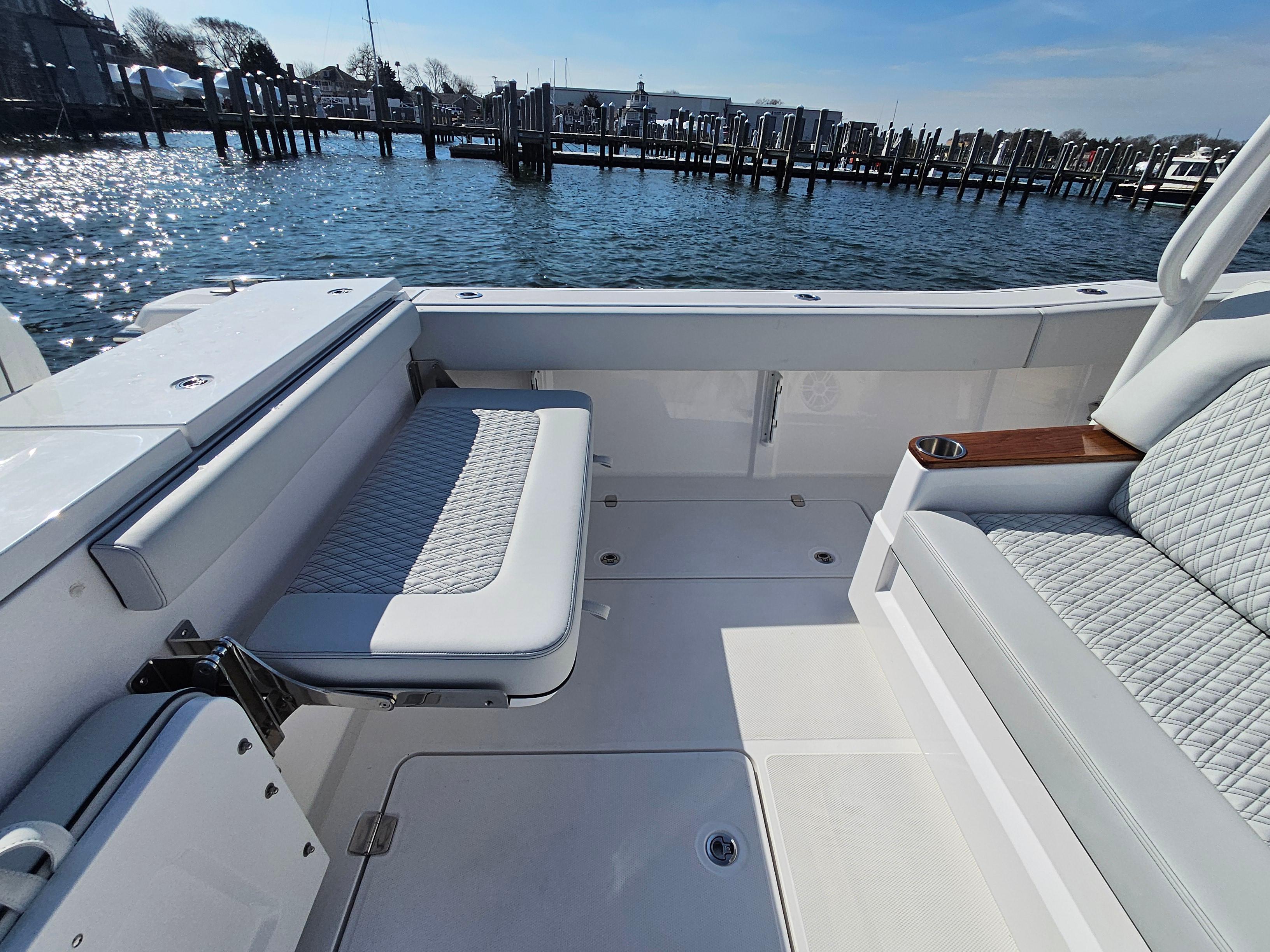 2025 Southport 38 FE boat interior with cushioned seating, dockside view.