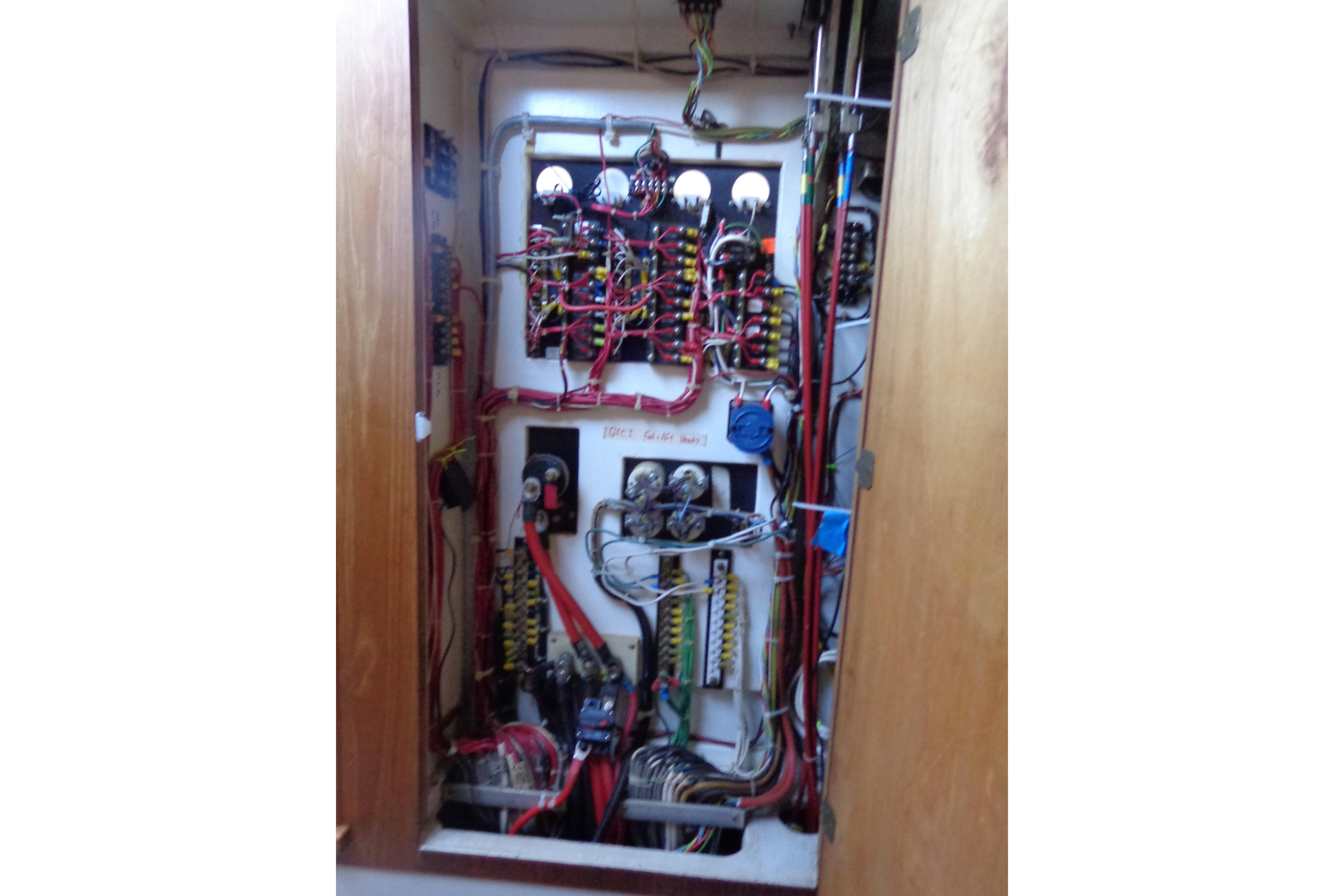 Electrical panel inside 1992 Cruise-A-Home Corsair 4200, showcasing wiring and components.