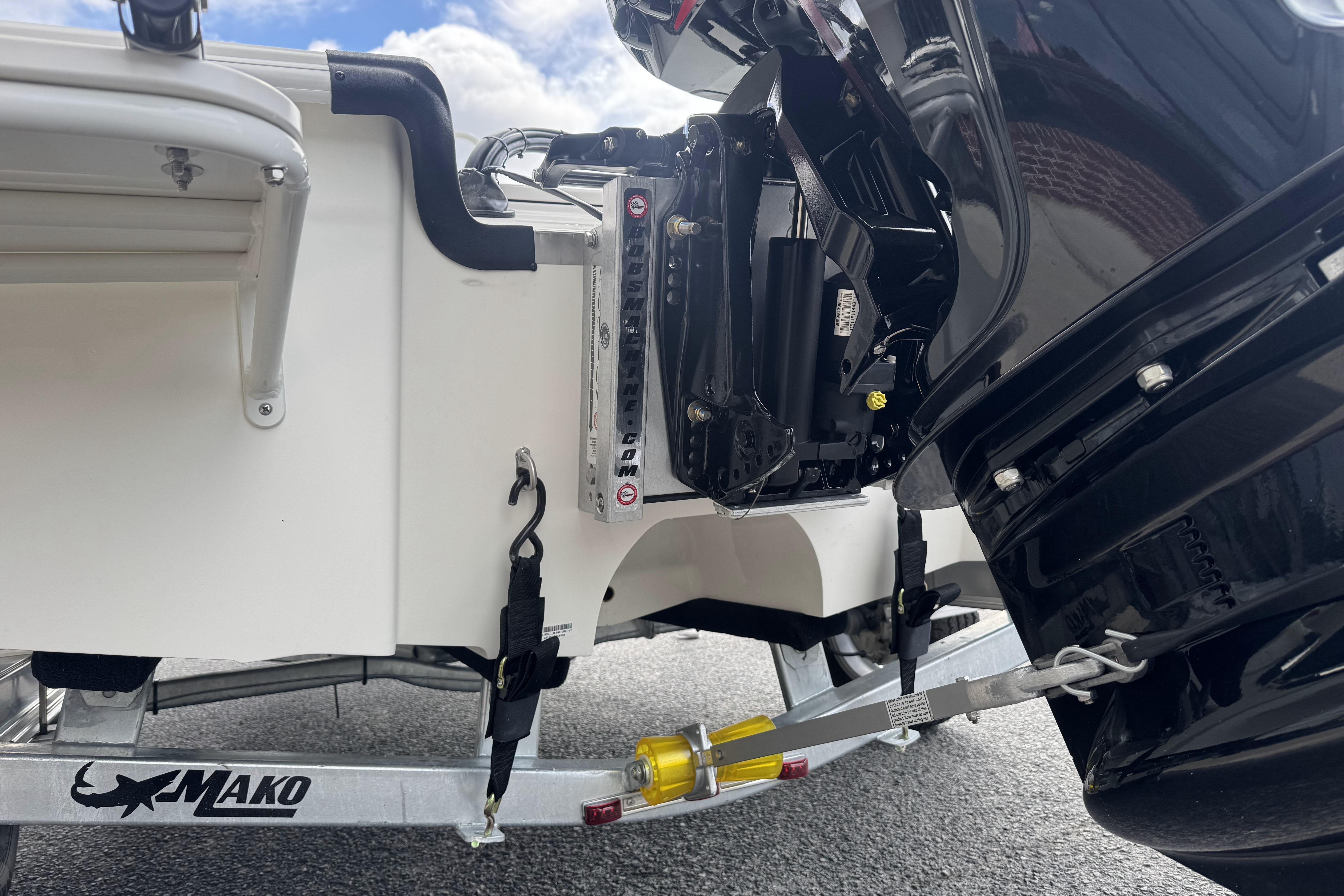 2026 Mako 18 Pro Skiff boat trailer and motor detail, showcasing sturdy construction.