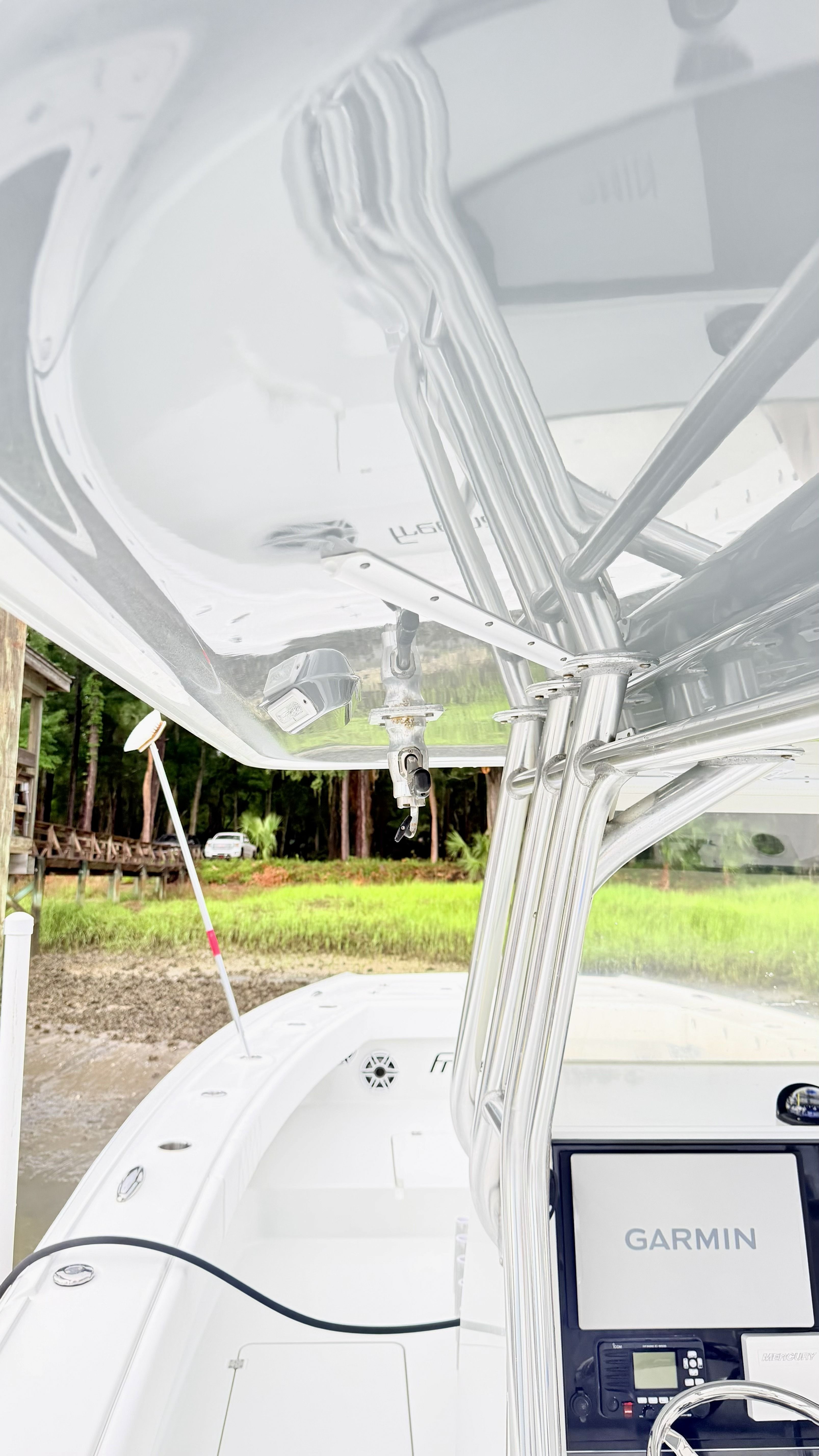 The image shows the cockpit of a 2018 Freeman 34VH boat with a Garmin navigation system.