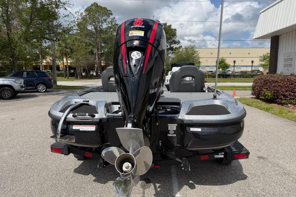 2026 Nitro Z18 boat with powerful outboard motor, parked outdoors.