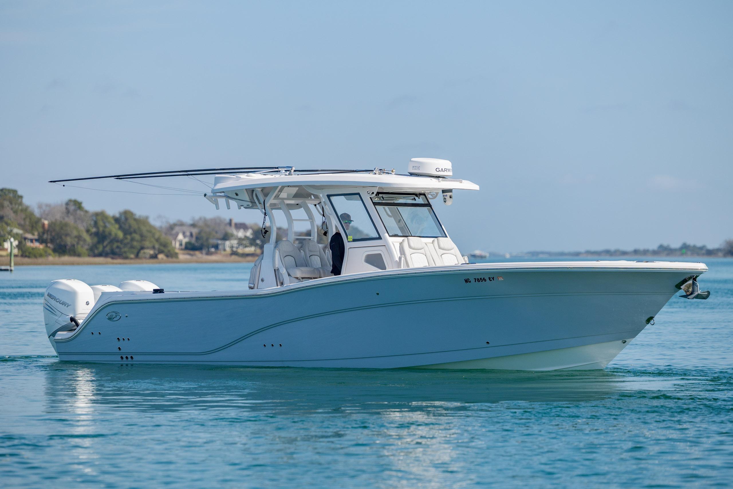 2022 Sea Fox 368 Commander boat cruising on calm blue waters.