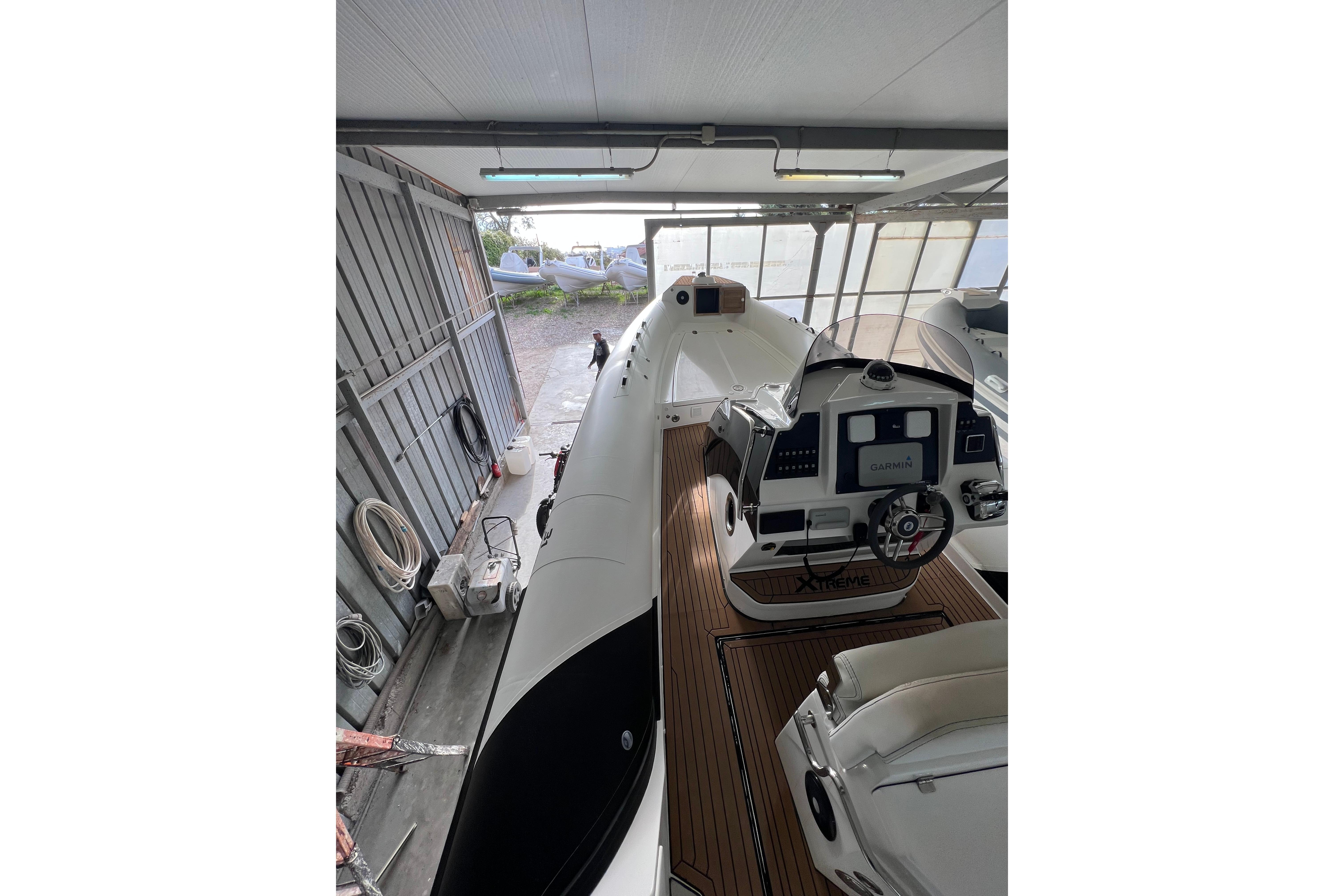 Novamares 31 Extreme 2021 boat in storage, featuring modern cockpit and sleek design.