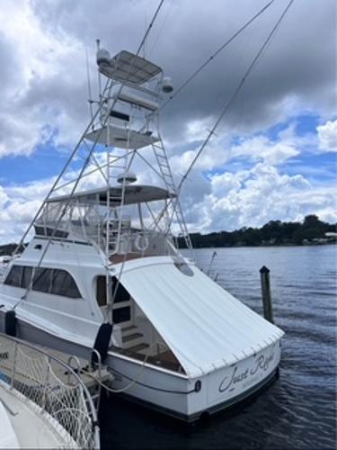 1986 Egg Harbor 60 Sportfisherman yacht docked under cloudy sky.