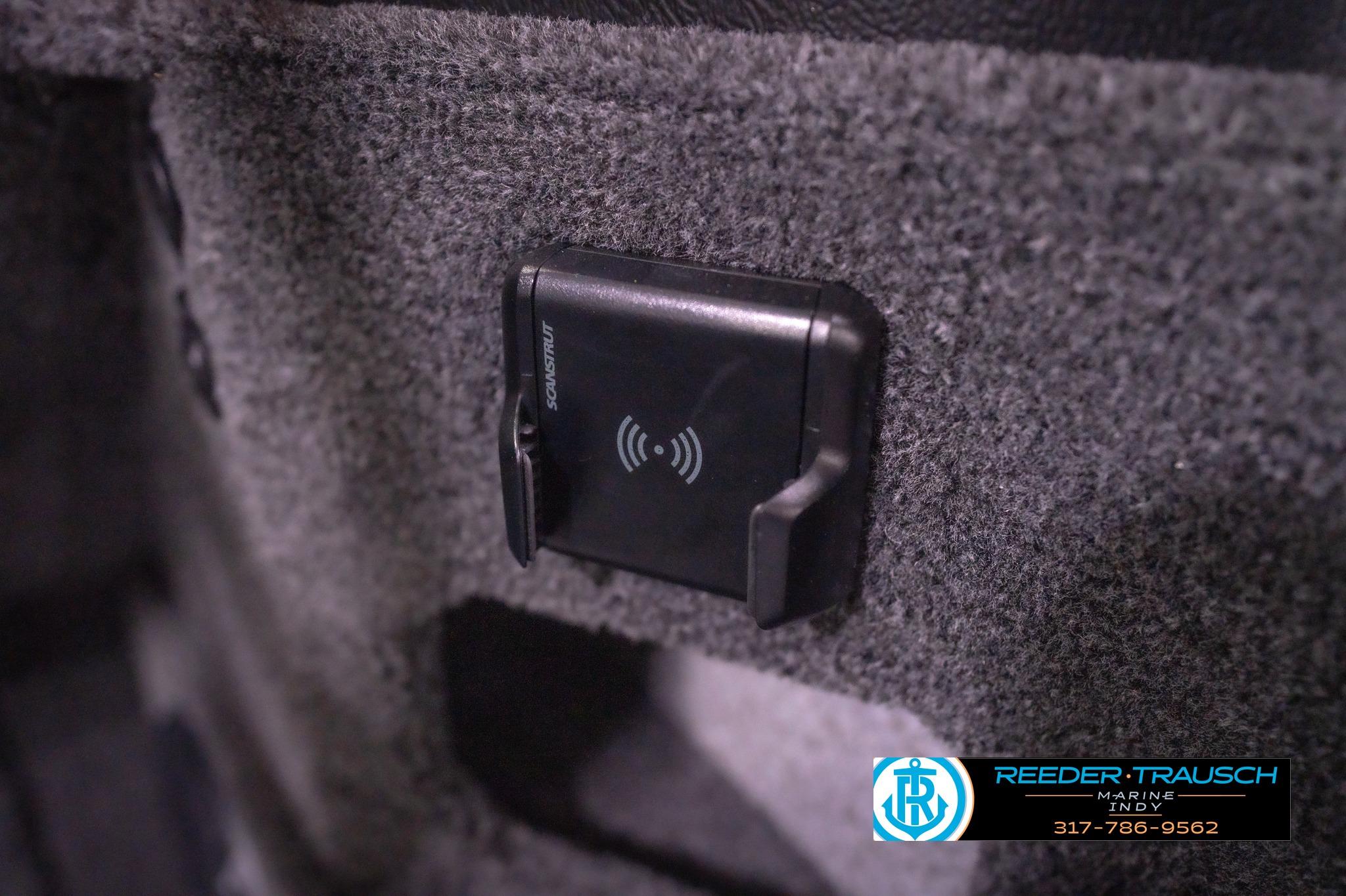 2026 Lund 2075 Impact XS boat interior with wireless charging pad.