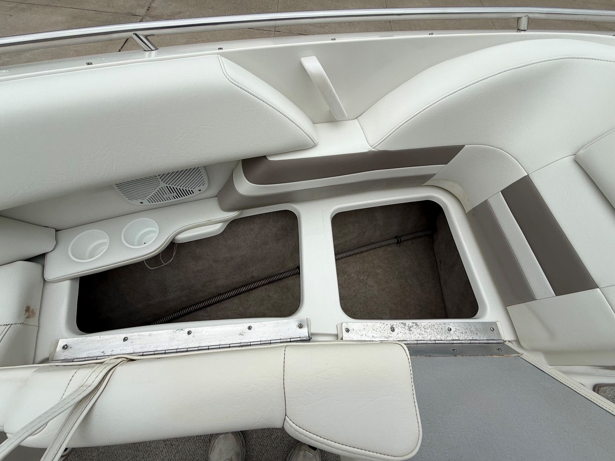 Interior of a 1998 Formula Thunderbird boat with storage compartment.