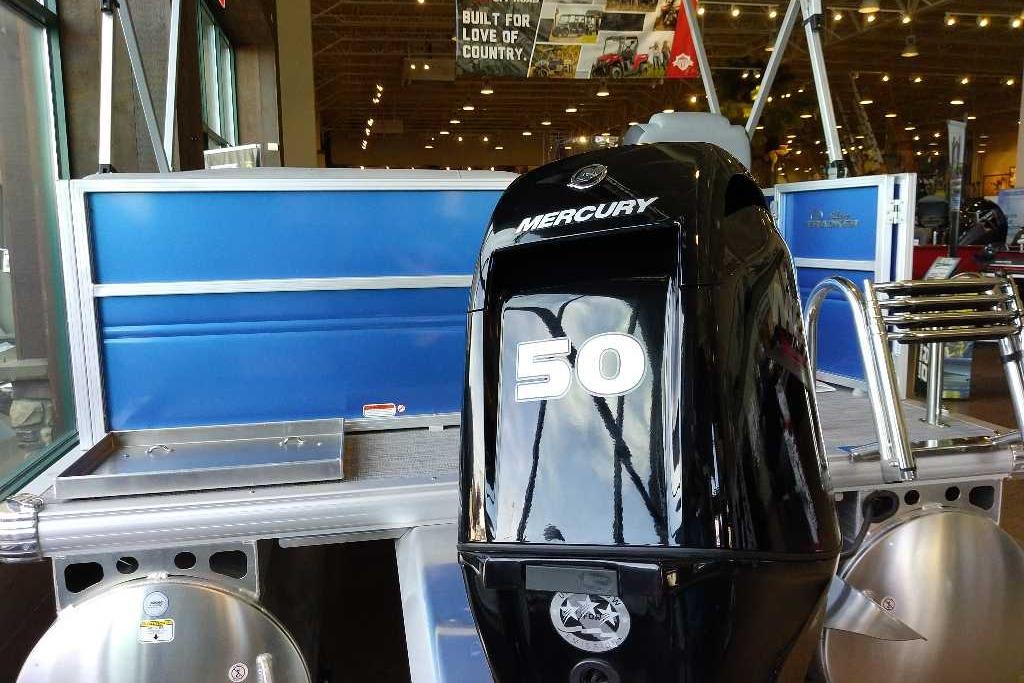 2026 Sun Tracker Party Barge 16 DLX with Mercury 50 engine in showroom.