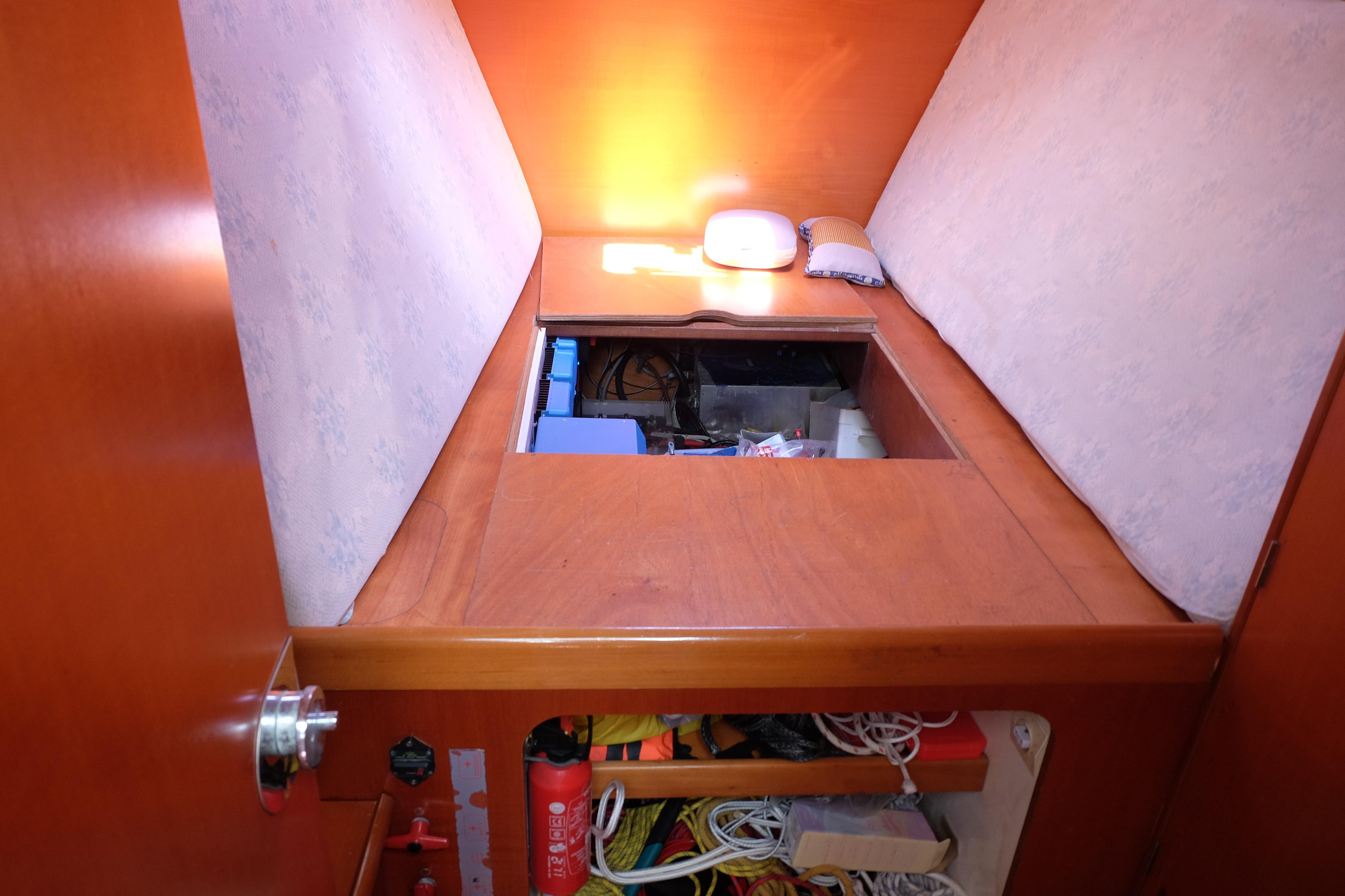 Interior of a 2000 Lagoon 380 yacht showing storage compartment and equipment.