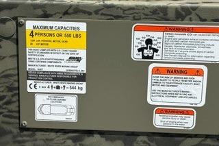Capacity and warning labels on 2025 Tracker Grizzly 1650 T Prairie Wings Edition.