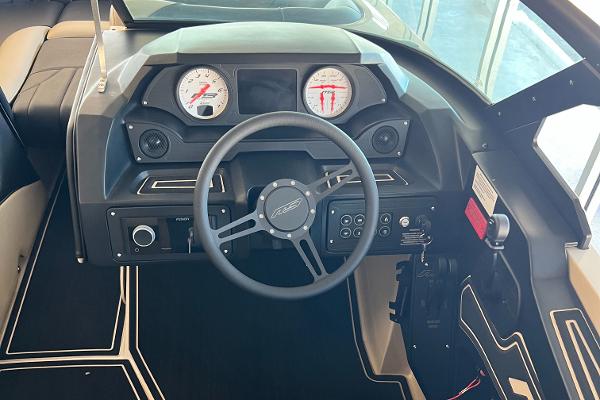2024 MB F22 Tomcat boat dashboard with steering wheel and gauges.