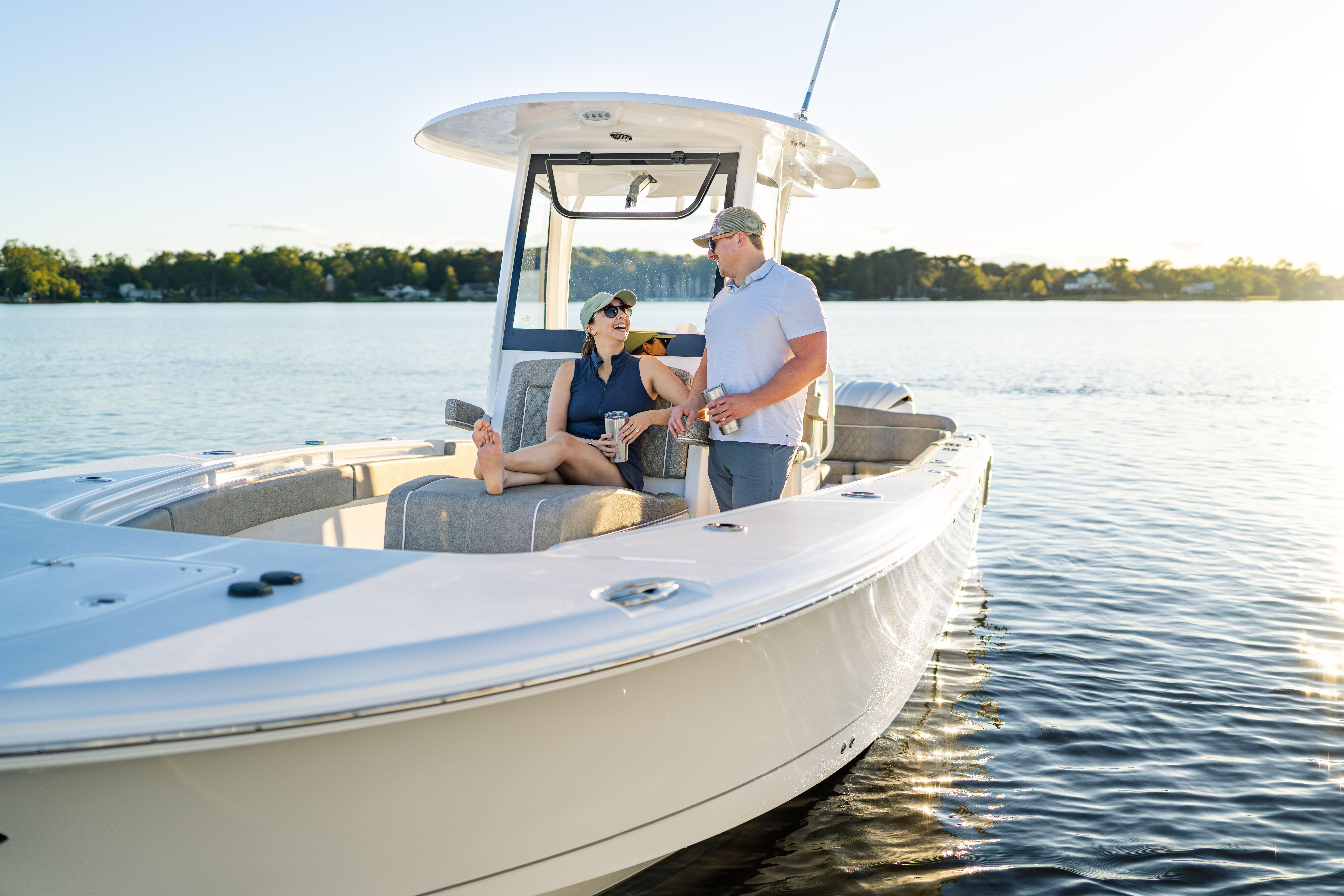 Couple enjoying a sunny day on a 2026 Sea Hunt Ultra 275 Coffin Box boat.