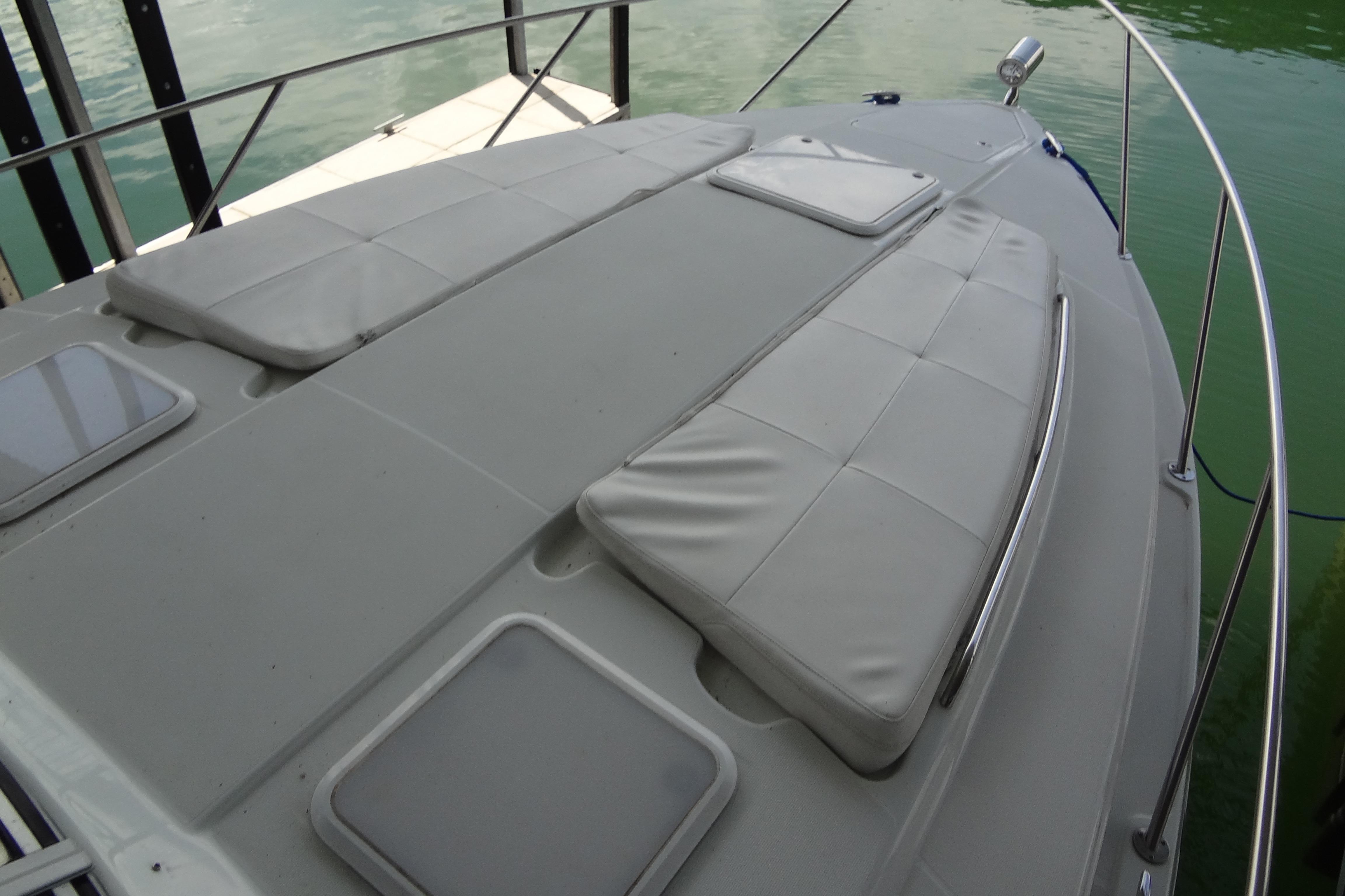 2007 Formula 34 Performance Cruiser with cushioned deck, docked on calm water.