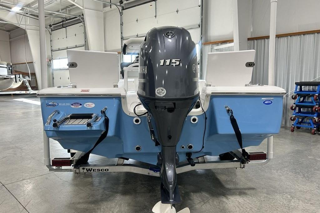 2026 Tidewater 1910 Bay Max boat with Yamaha 115 engine in a showroom.