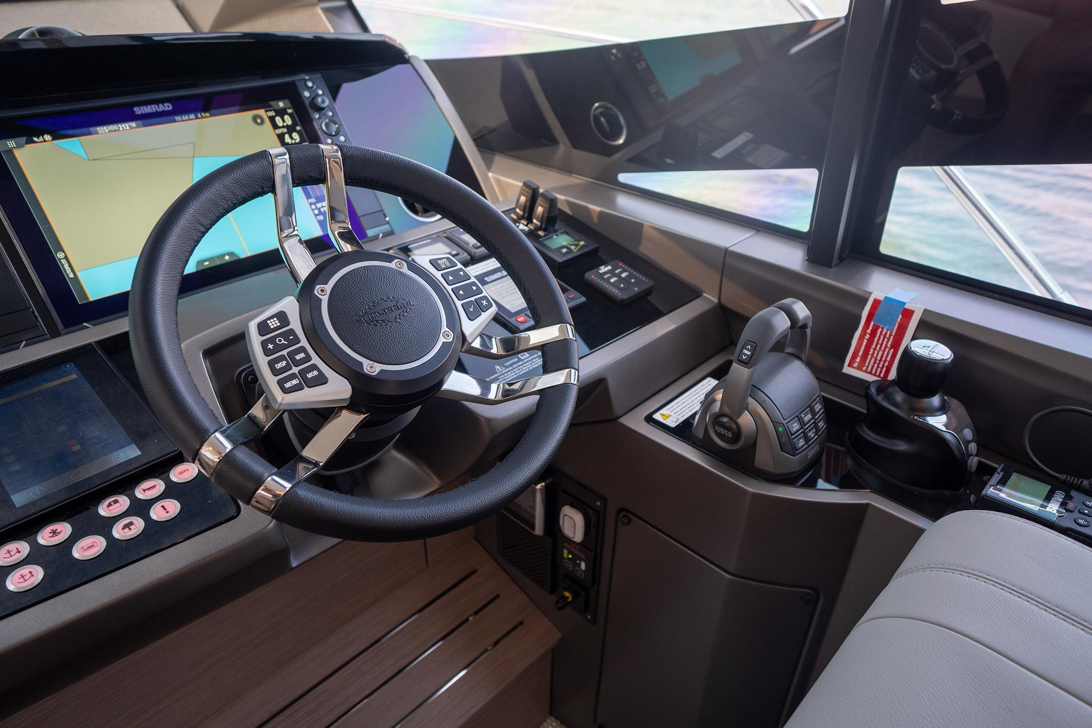 Helm of 2024 Sunseeker Manhattan 55 yacht with advanced navigation controls and displays.