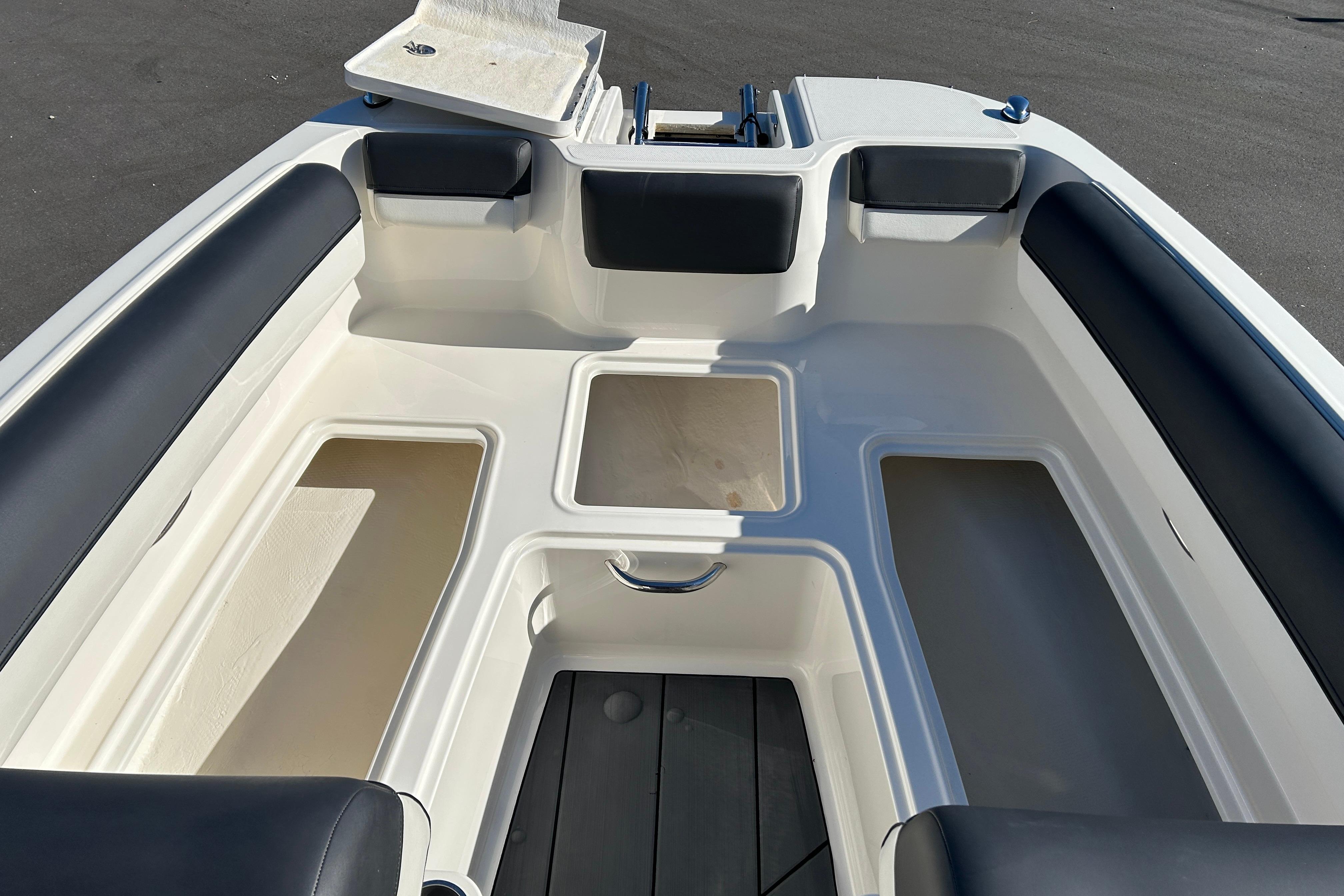 2020 Bayliner DX 2000 boat interior with seating and storage compartments.