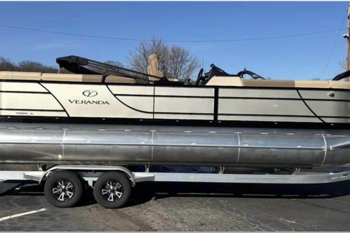 2025 Veranda VR25RC XL pontoon boat on trailer, side view, sunny day.